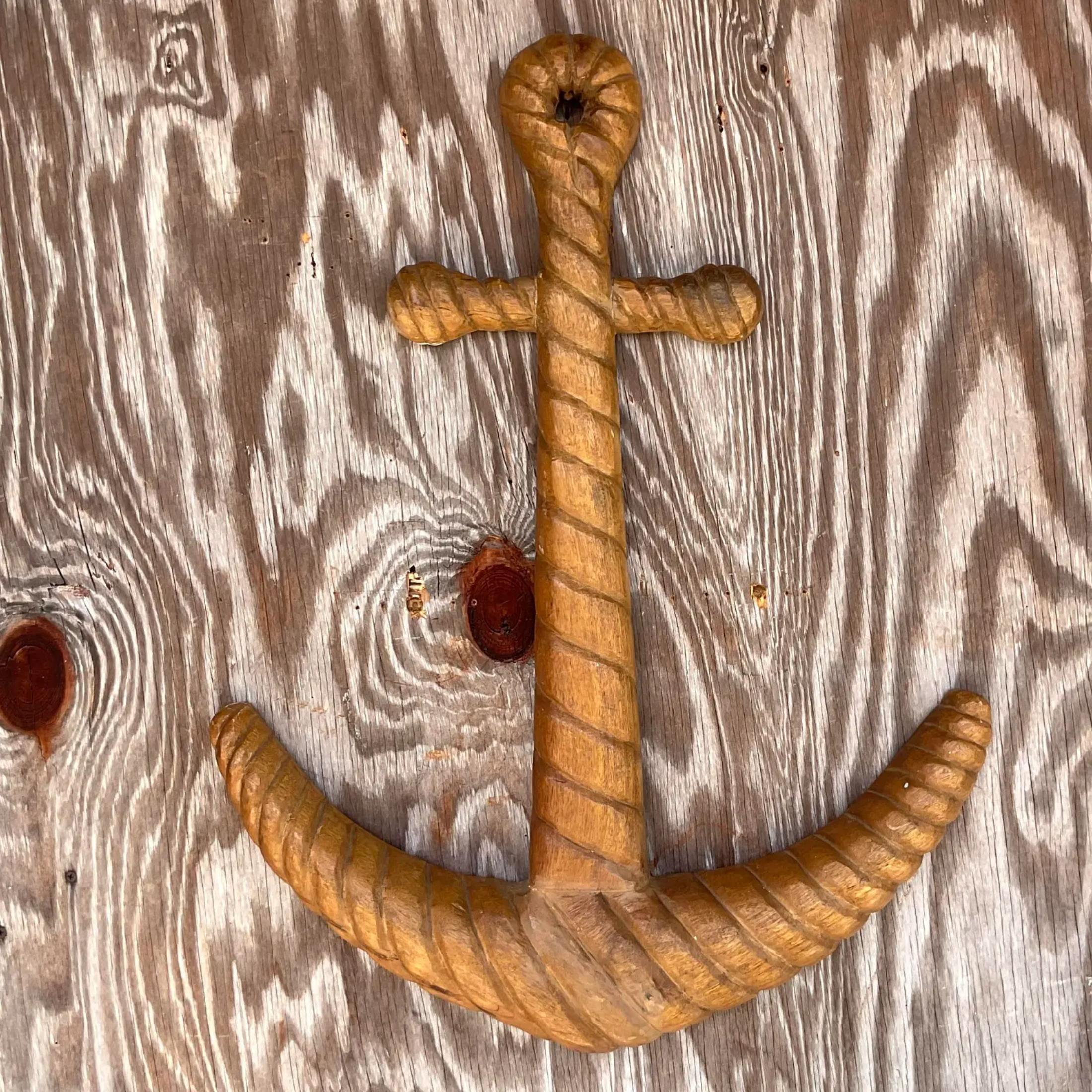 A stunning vintage coastal carved wall sculpture. A chic rustic anchor with a beautiful patina from time. Perched in Mystic Connecticut in the 70s. Acquired from a Palm Beach estate. 

