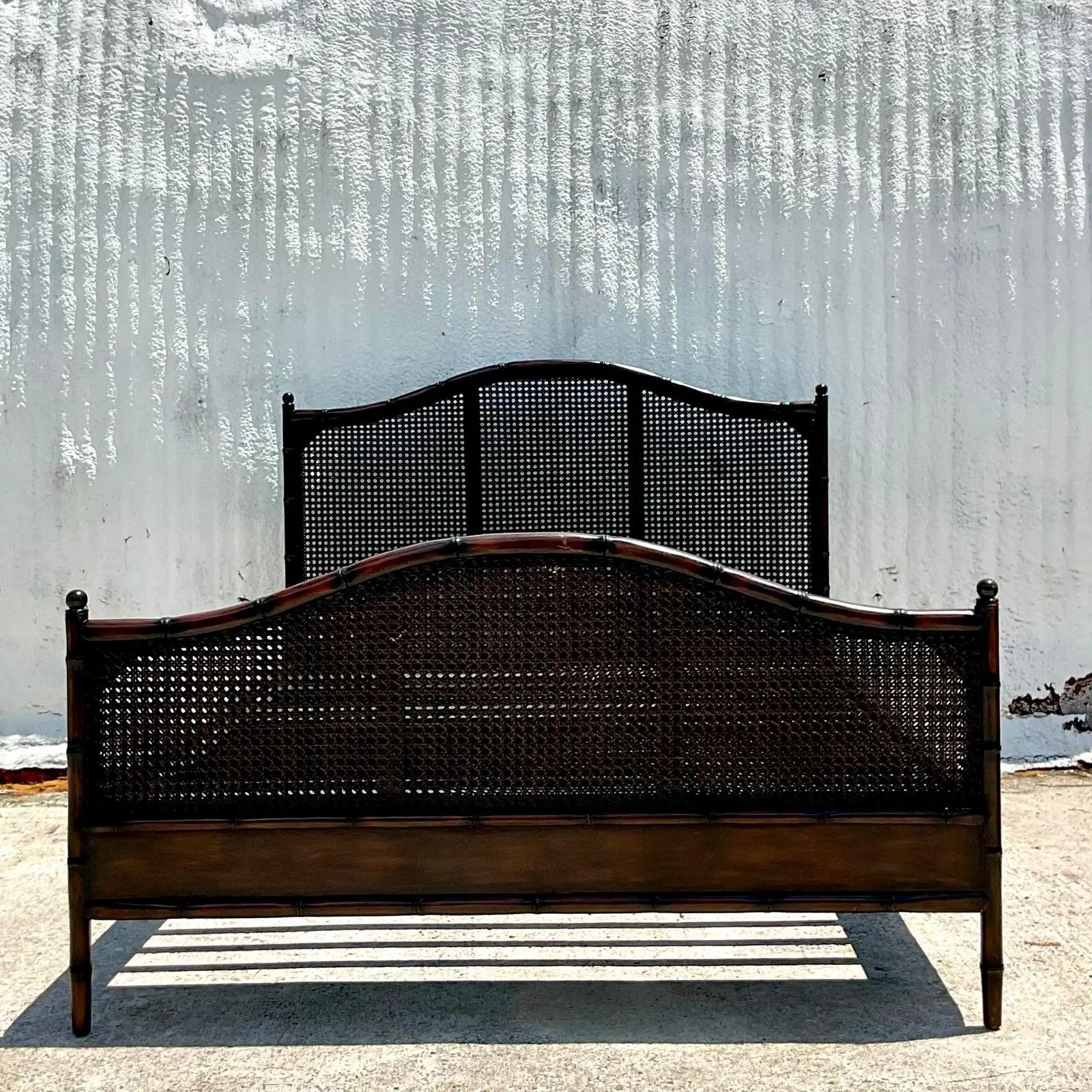 A fantastic vintage Costal queen bed frame. A beautiful high back bed frame with carved bamboo and inset cane panels. A beautiful rich brown. Acquired from a Palm Beach estate.