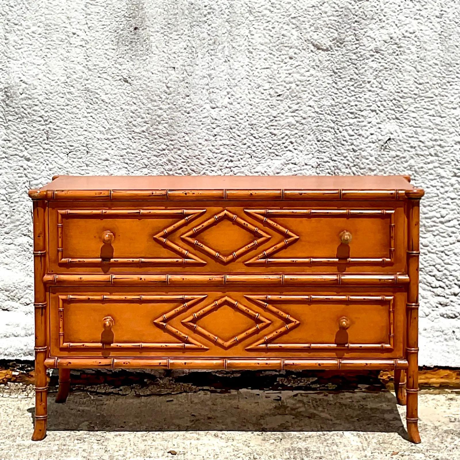 Fantastic vintage Coastal chest of drawers. Beautiful carved bamboo detail on a lower profile shape. Gorgeous warm brown finish. Acquired from a Palm Beach estate.