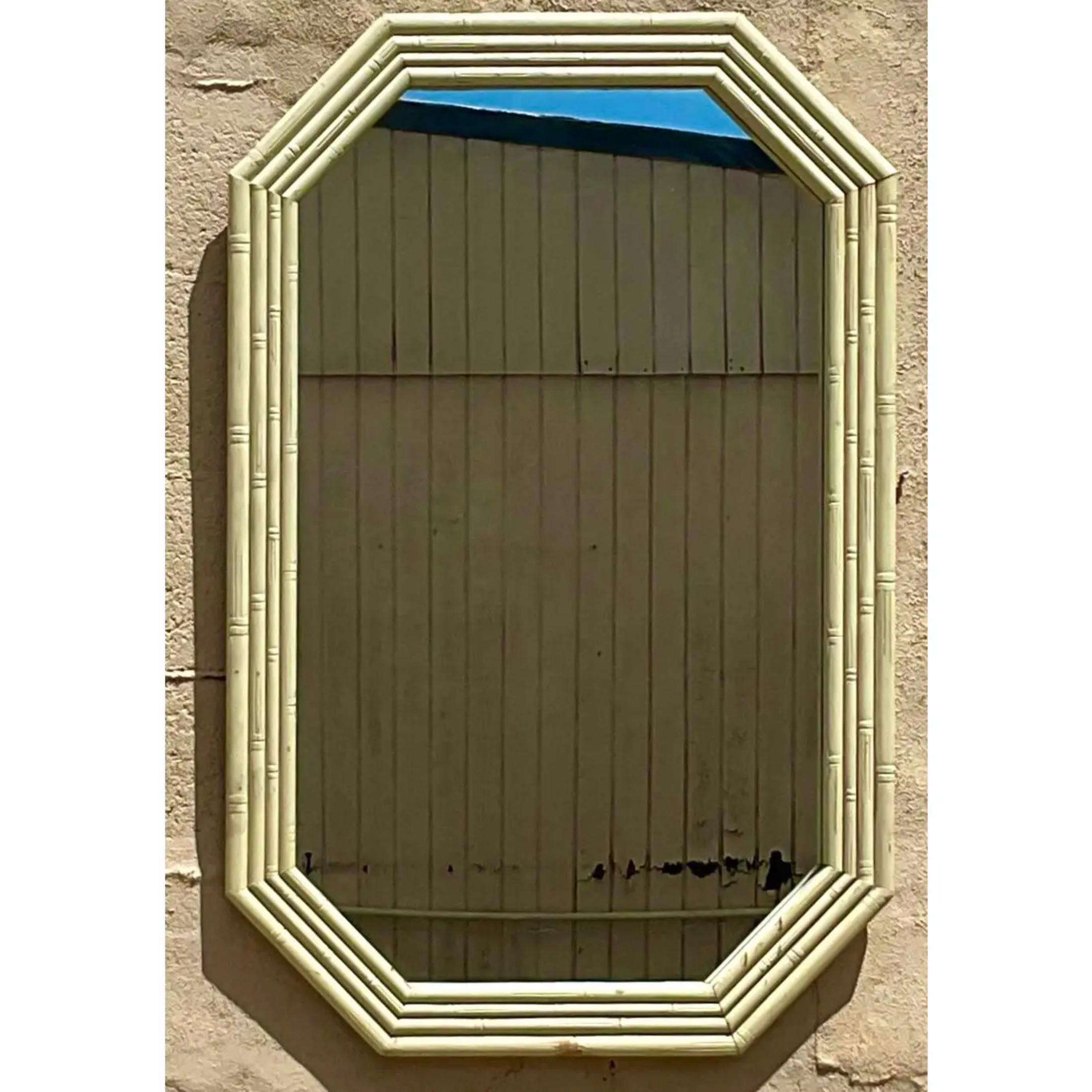 An absolutely beautiful vintage wall mirror in a unique octagonal shape. Hand carved wood bamboo design. Needs a little TLC, but then you will have a beauty of a mirror. Acquired at a Palm Beach estate