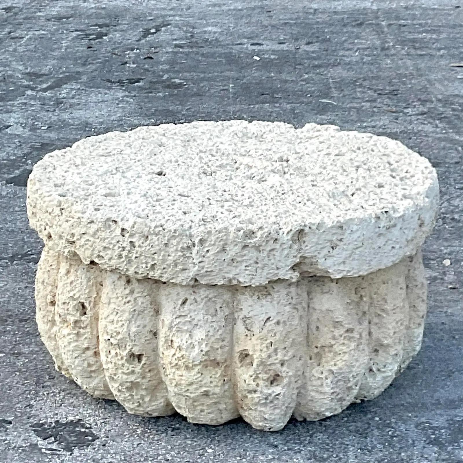 A fantastic vintage Coastal coffee table. Chic carved coquina stone in a scalloped design. Perfect as is or add larger glass for additional surface space. Acquired from a Palm Beach estate.