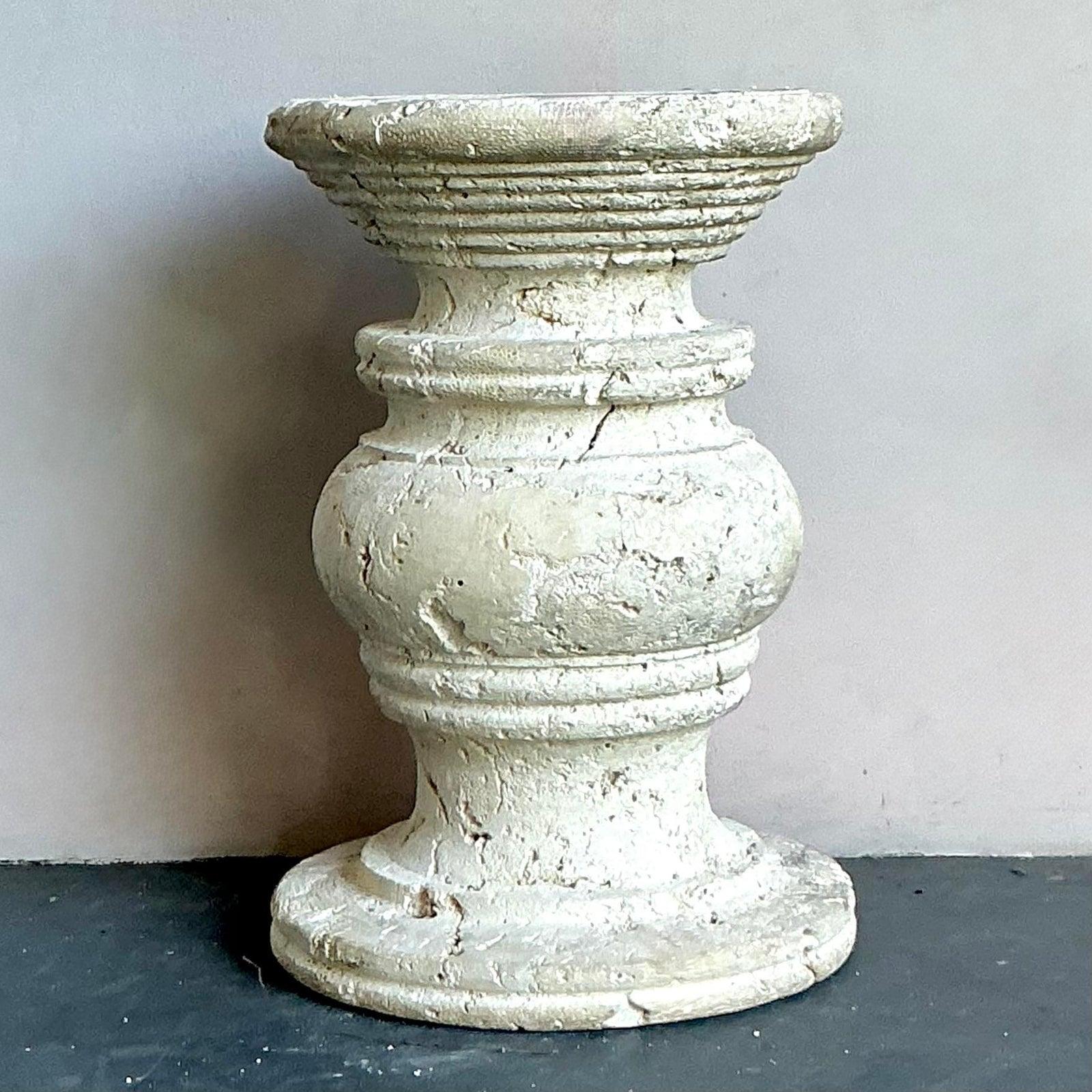 Evoke the serene beauty of the seaside with this exceptional vintage coastal table pedestal, masterfully carved from coquina stone. The natural, rough-hewn texture and subtle variations in the stone capture an organic elegance, making it a perfect