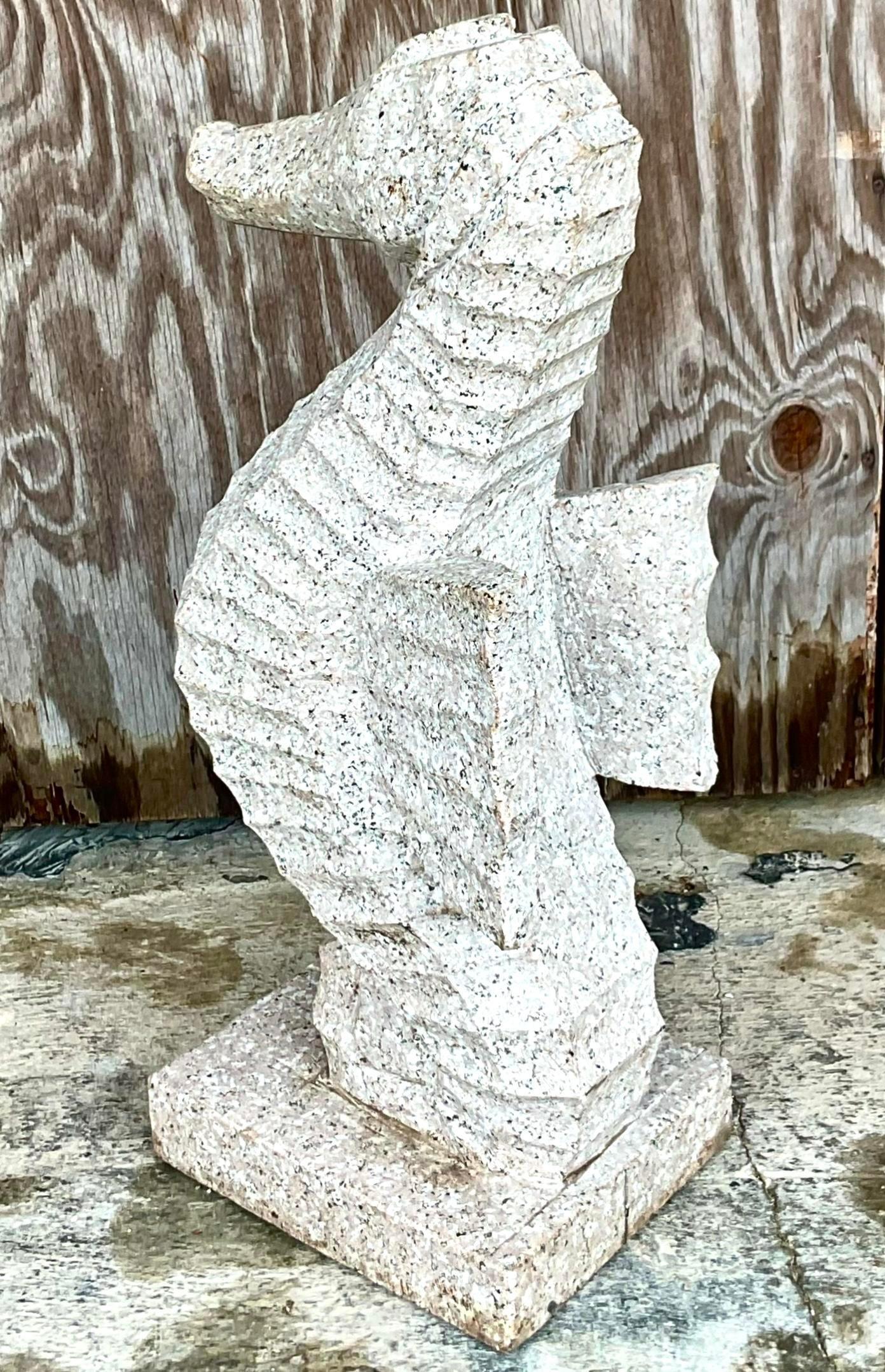 Add a touch of coastal charm with this hand-carved stone seahorse statue. Its intricate detailing and natural stone texture make it a timeless piece, perfect for beach-inspired interiors. Ideal for indoor or outdoor decor, this vintage treasure