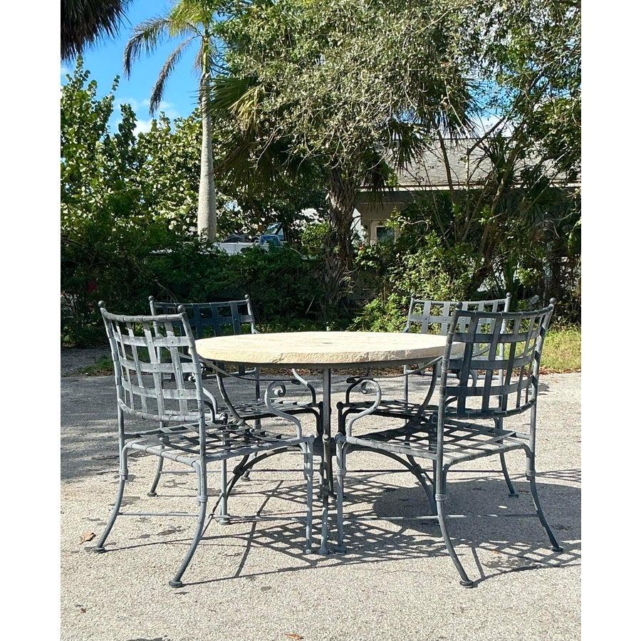 Elevate your outdoor living space with this stunning vintage coastal outdoor dining set. Crafted from durable cast aluminum, the intricate lattice design of the table and chairs adds a touch of timeless elegance to any patio or garden. The circular