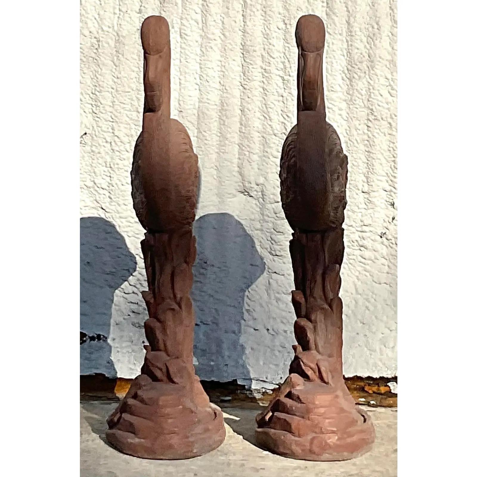 A fabulous pair of vintage Coastal outdoor statues. Chic cast cement in a pale terracotta color. Perfect outside or indoors. You decide! Acquired from a Palm Beach estate.