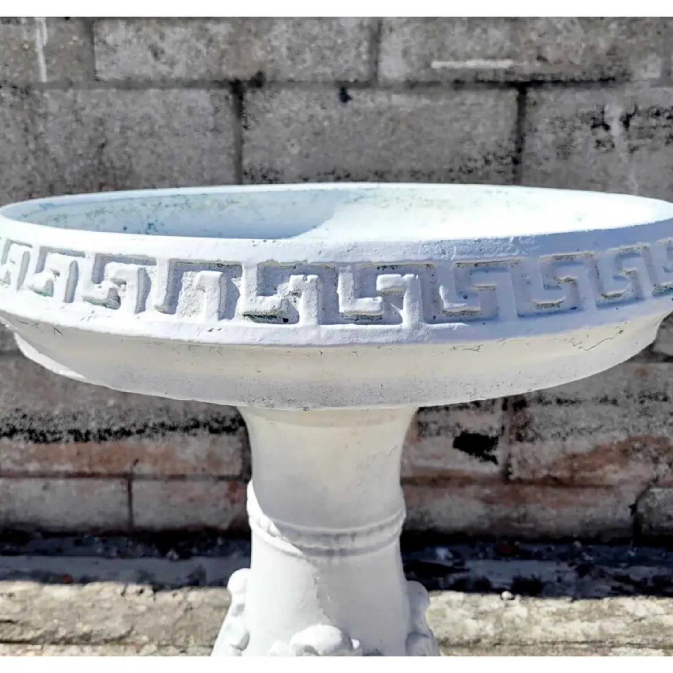 Fantastic vintage cast concrete bird bath. Beautiful Greek Key border with a flee de Lys pedestal. A really special addition to any garden. Acquired from a Palm Beach estate.
