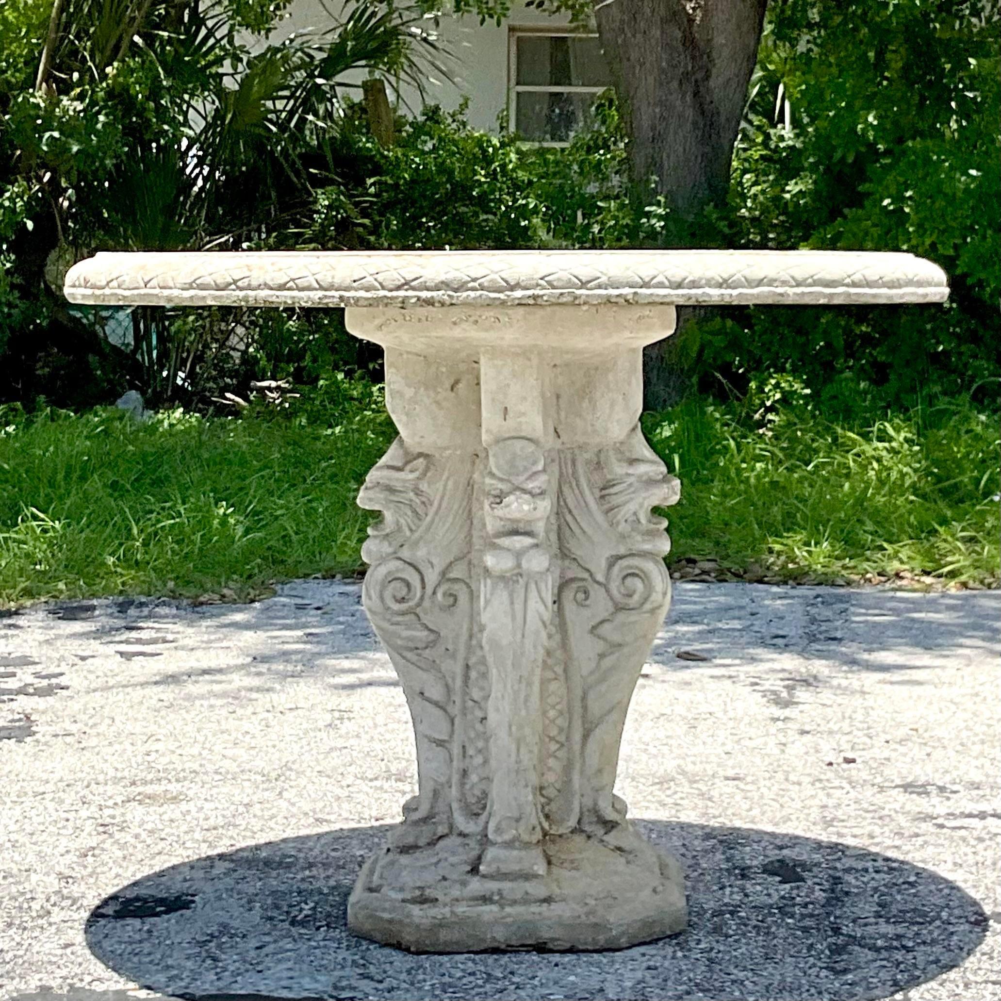 A fantastic vintage Coastal cast concrete outdoor dining table. A chic grotto design with serpent pedestal.