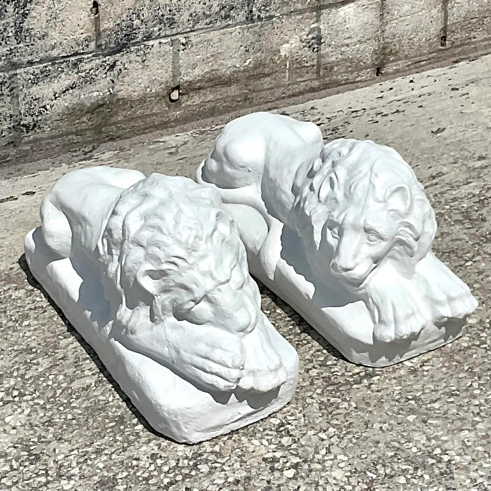 Fabulous pair of cement lions. Add a little glamour to your entrance or garden. Beautiful matte plaster finish over solid cement. Acquired from a Palm Beach estate.