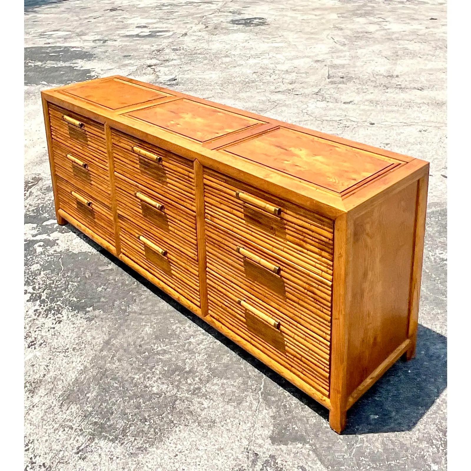 Fantastic vintage Coastal dresser. Made by the iconic Century furniture company. Beautiful carved bamboo detail and chic bamboo drawer pulls. Marked on the inside. Acquired from a Palm Beach estate.