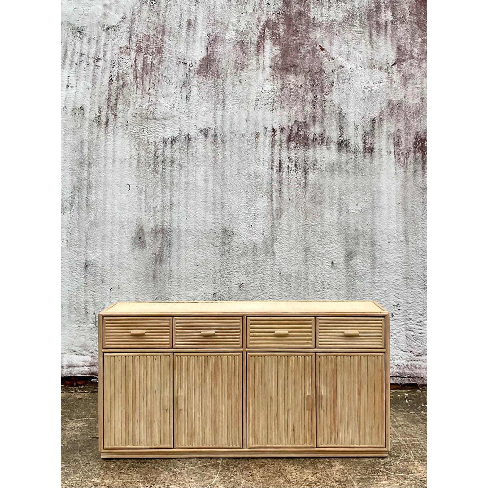 Fantastic vintage Coastal credenza. Beautiful cerused bamboo with a chic woven top. Lots of additional storage below. Tall and glamorous. Acquired from a Palm Beach estate.