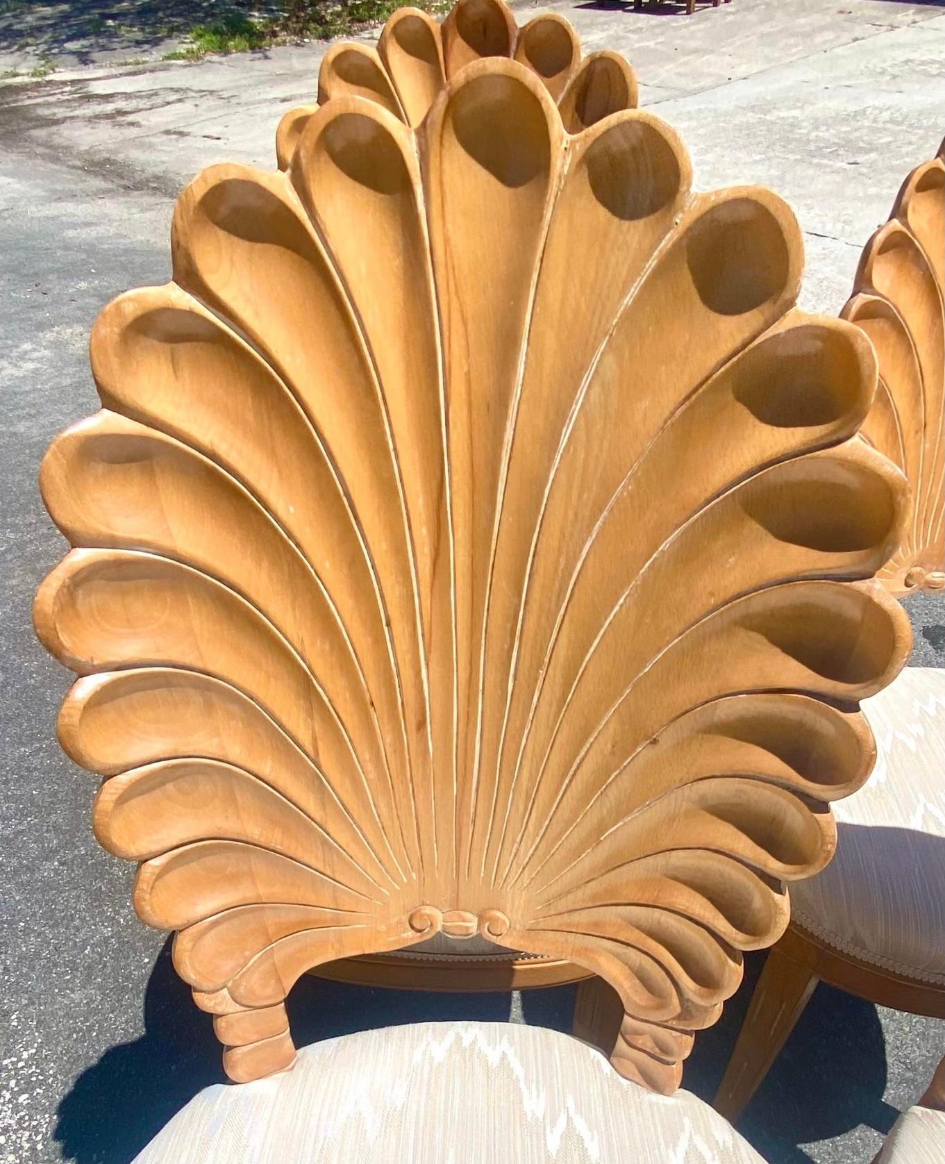 Fantastic set of carved grotto chairs. Beautiful Cerused finish on an iconic carved design. Perfect as dining chairs or with a game table. Acquired from a Palm Beach estate.