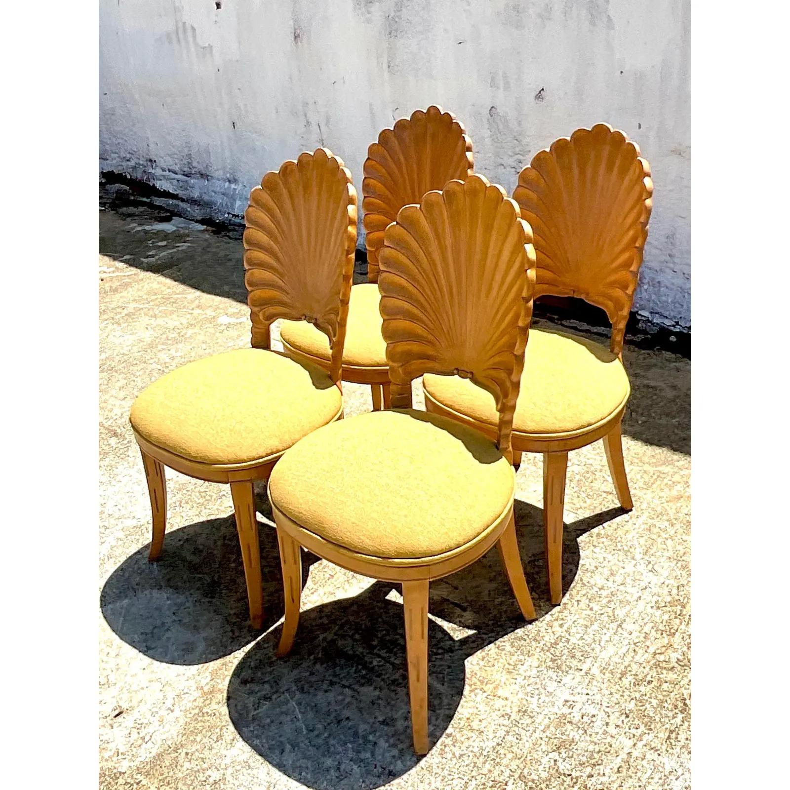 Incredible set of four vintage hand carved Grotto chairs. Beautiful iconic shape in a chic cerused finish. Acquired from a Palm Beach estate.
