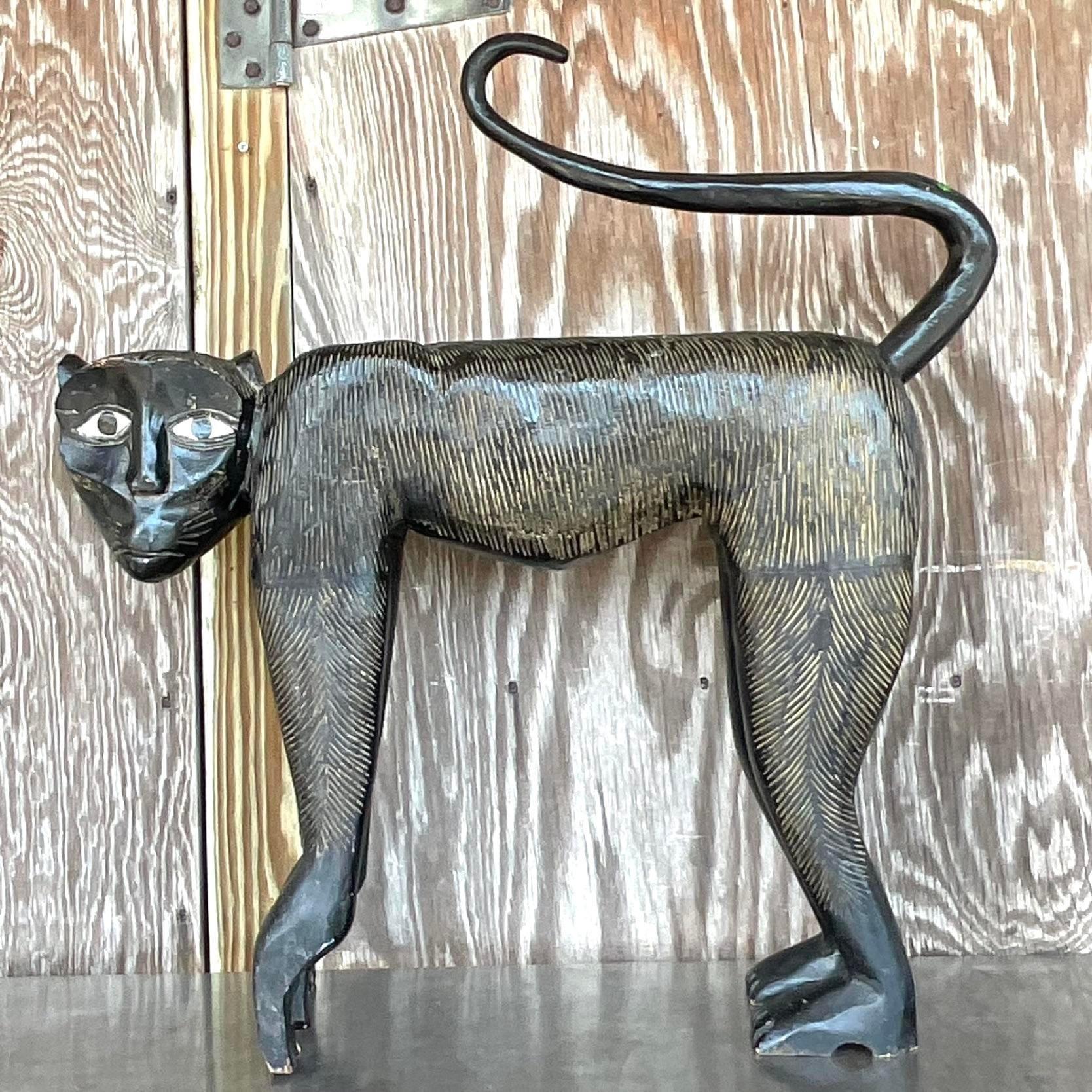 A fabulous vintage Boho wooden monkey. A chic cerused finish on a gloss block paint. Acquired from a Palm Beach estate.