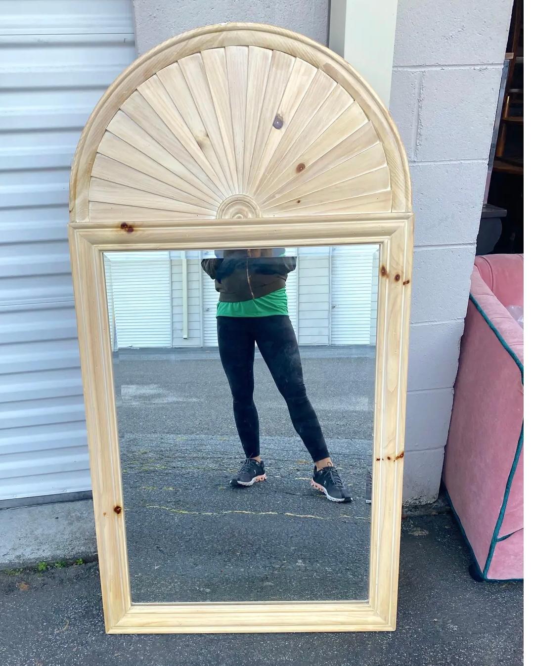 A fantastic caroused pine beveled mirror with a sun ray domed top. Very well made.