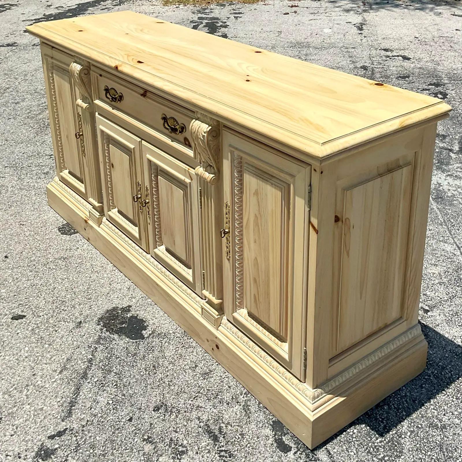 Stunning vintage Coastal credenza. Beautiful cerused pine with all over hand carved detail. Lots of amazing storage below. Acquired from a Palm Beach estate.
