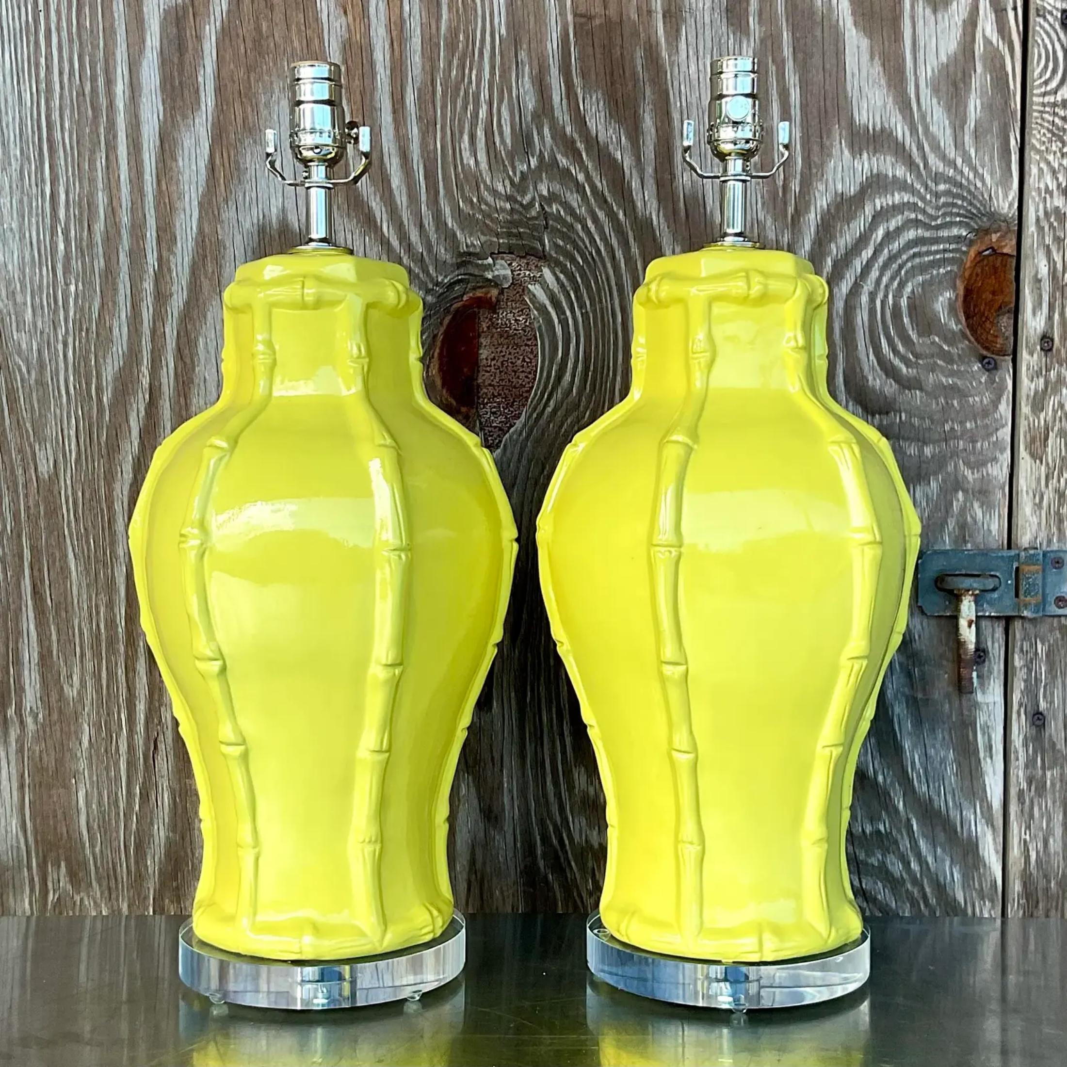 A fabulous pair of vintage Coastal table lamps. Beautiful Chartreuse color on a classic bamboo design. Fully restored with all new wiring, hardware and lucite plinths. Acquired from a Palm Beach estate. 