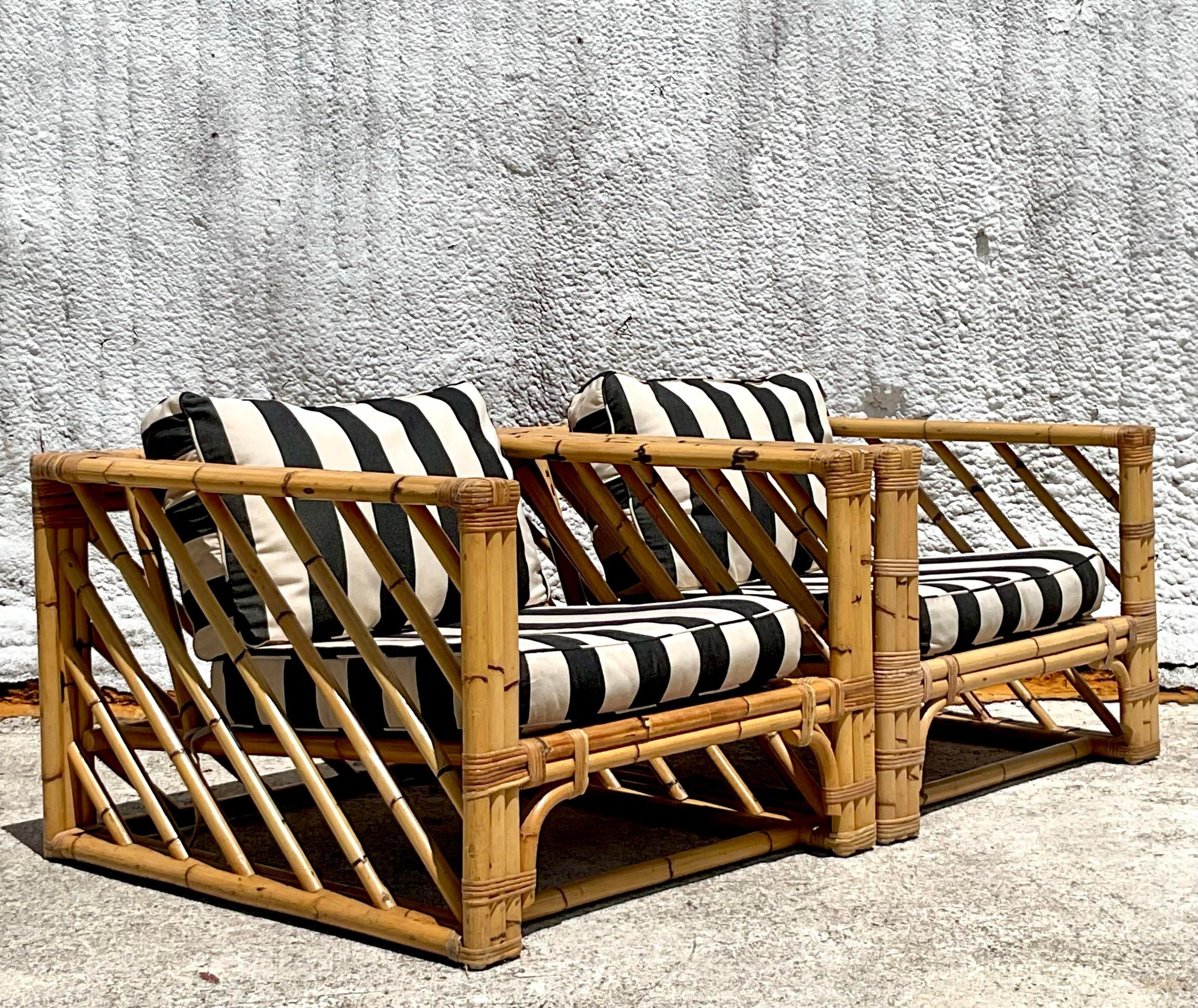 A fabulous pair of vintage Coastal lounge chairs. A chic bamboo in a fabulous Chevron design. A really striking design. Acquired from a Palm Beach estate