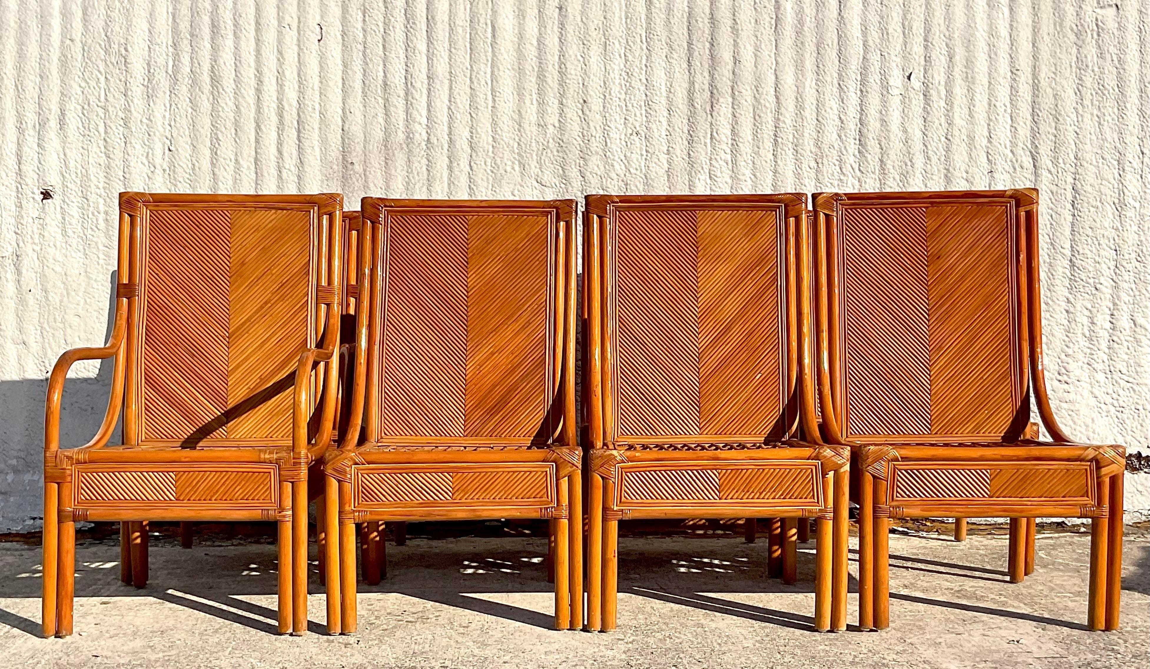 A fantastic set of 8 vintage Coastal dining chairs. Incredible pencil reed frame in a chic Chevron design. Two arm chairs and six sides. Acquired from a Palm Beach estate.