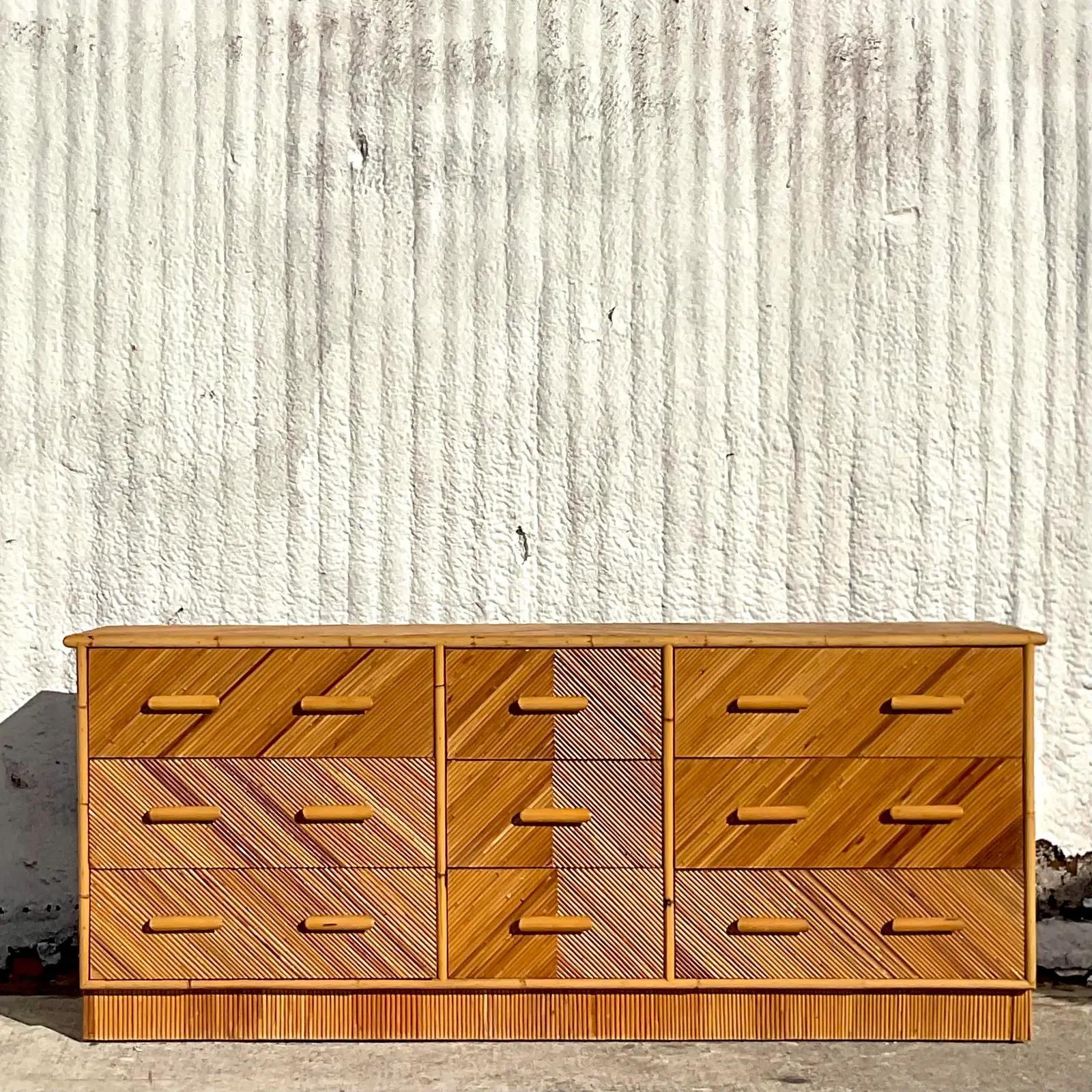 A fabulous vintage Coastal 9 drawer dresser. Beautiful pencil reed frame with a chic Chevron design. Acquired from a Palm Beach estate.