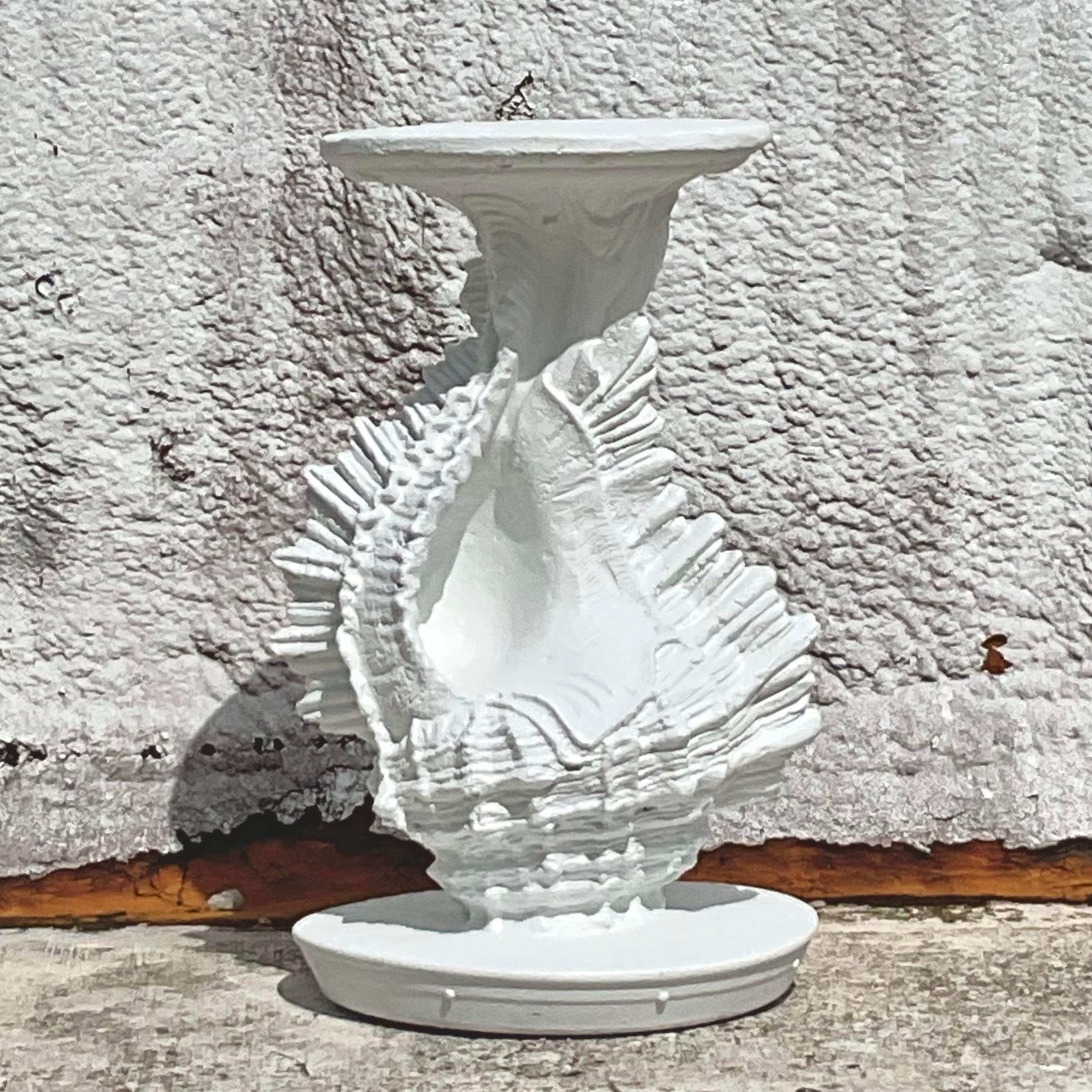 Elegant vintage coastal pedestal featuring a beautifully crafted conch shell design. A standout piece that brings seaside charm to your decor. Acquired from a Palm Beach estate