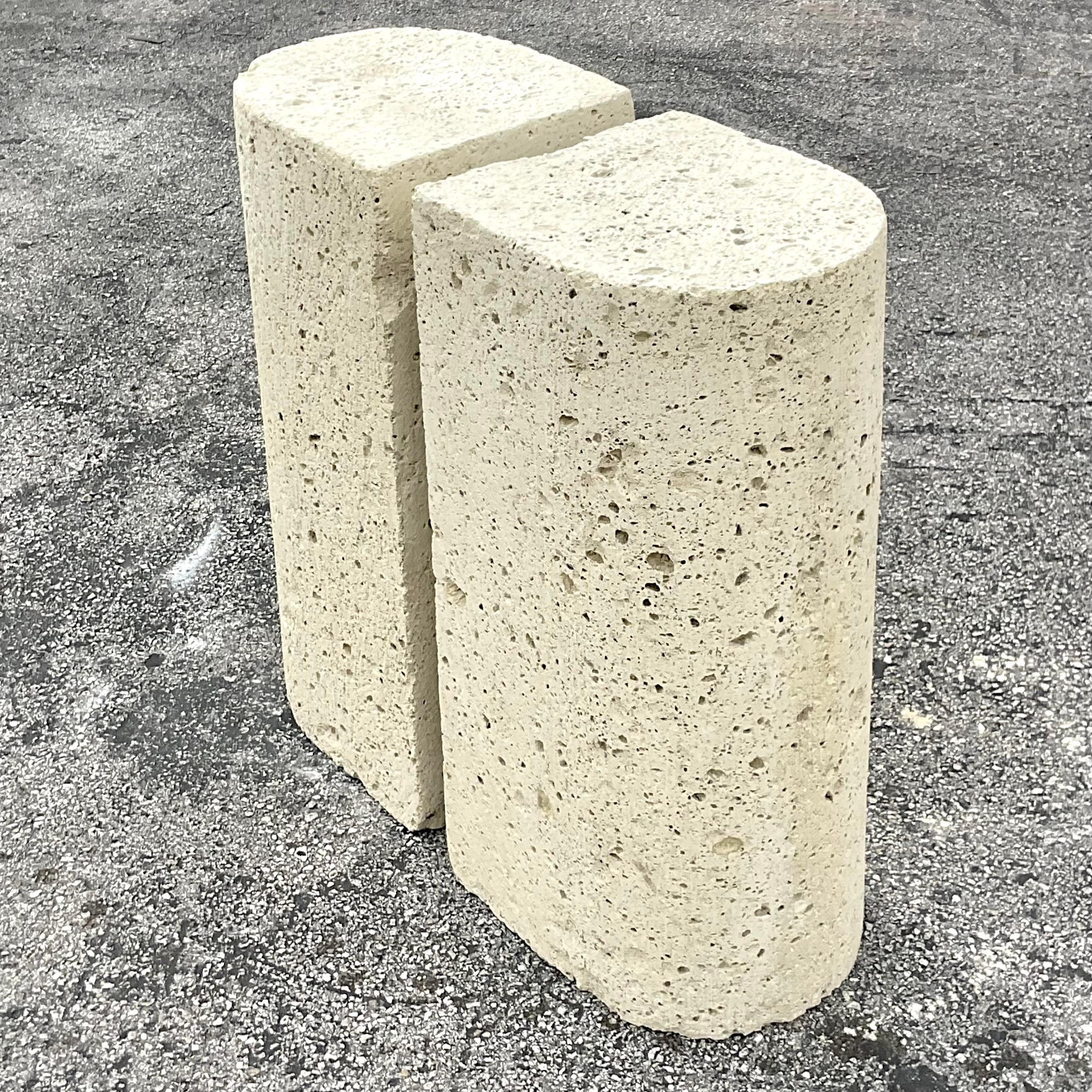 A Fantastic pair of vintage Coastal pedestals. Chic cut coquina stone in a fabulous arched design. Perfect as a pedestal for a defining table, console table or just gorgeous pedestals for your artwork. You decide! Acquired from a Palm Beach estate