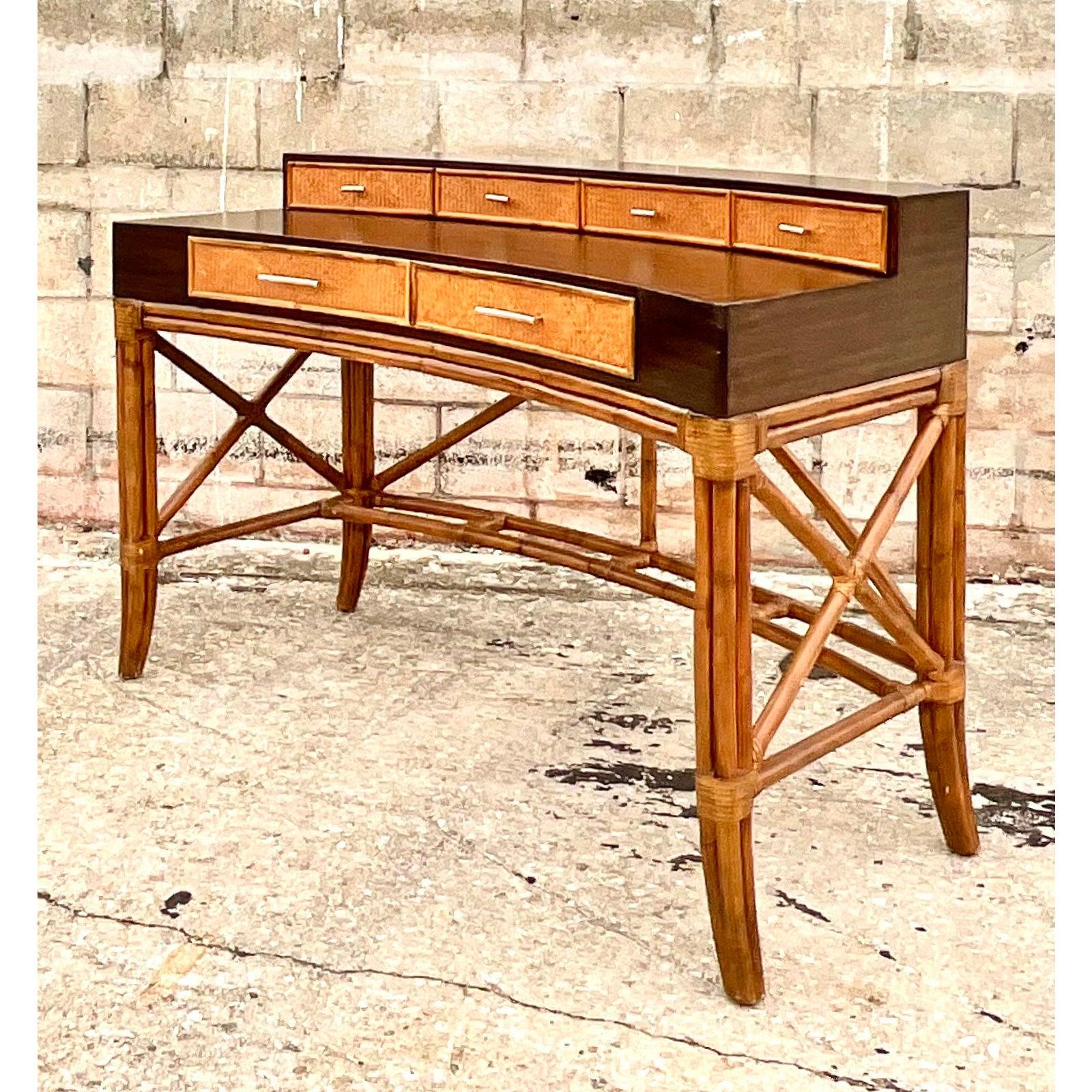 A fabulous vintage Coastal writing desk. Ebony wood cabinet with inset woven rattan panels. Rests on bent rattan base. Chic and glamorous. Acquired from a Palm Beach estate.