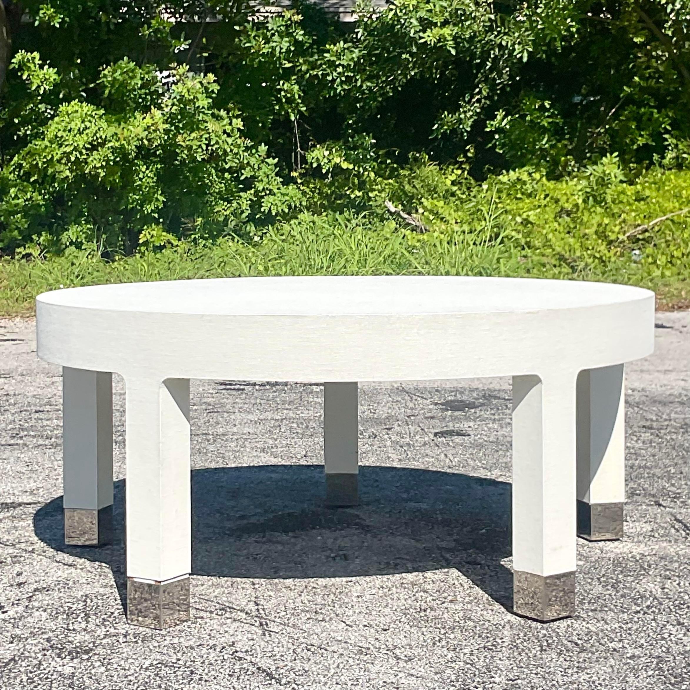 A fabulous vintage Custom built coffee table. A chic white Grasscloth finish with polished chrome leg caps. A real beauty and super well made. Acquired from a Palm Beach estate.