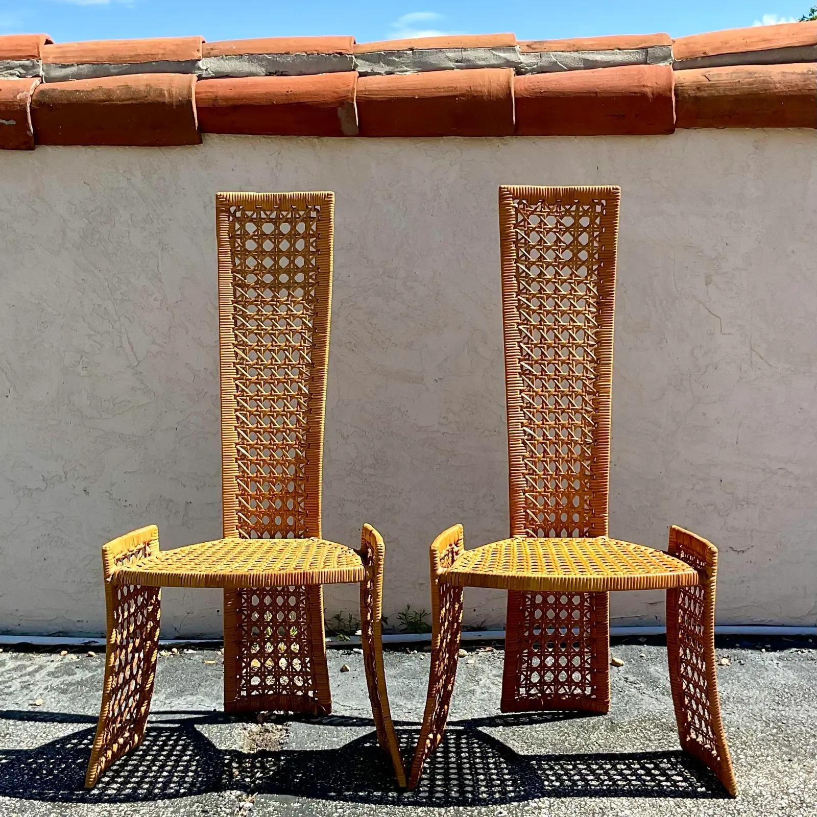 Fantastic vintage Coastal dining chairs. Made by the master of all things rattan Danny Ho Fong. Beautiful and dramatic high back shape. Perfect to add a flash of glamour to any space. Acquired from a Palm Beach estate.