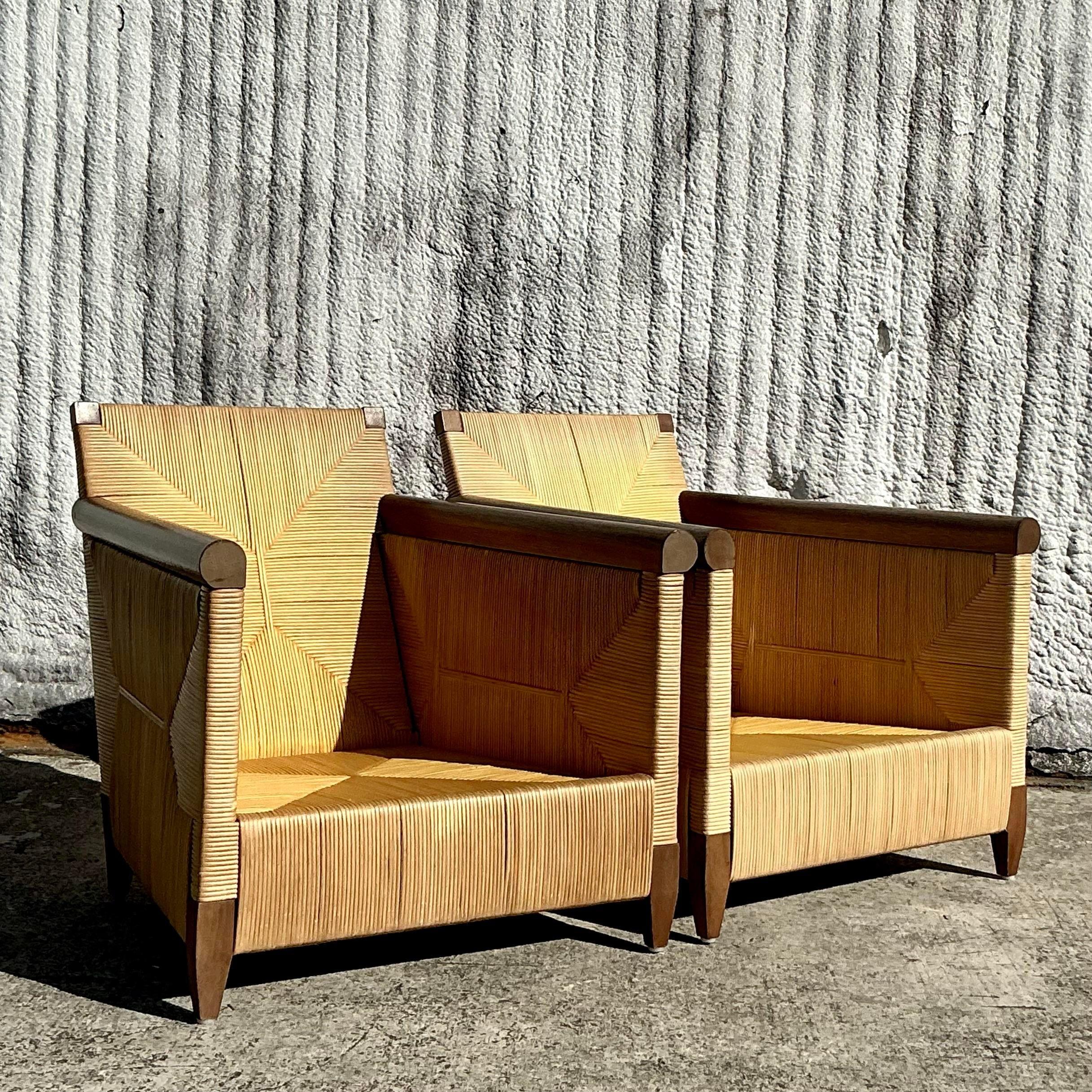 Elevate your space with this pair of Vintage Coastal Donghia “Merbau” Woven Rattan Lounge Chairs. Expertly crafted with sleek, low-profile frames and intricately woven rattan, these chairs exude effortless coastal elegance. Perfect for adding a