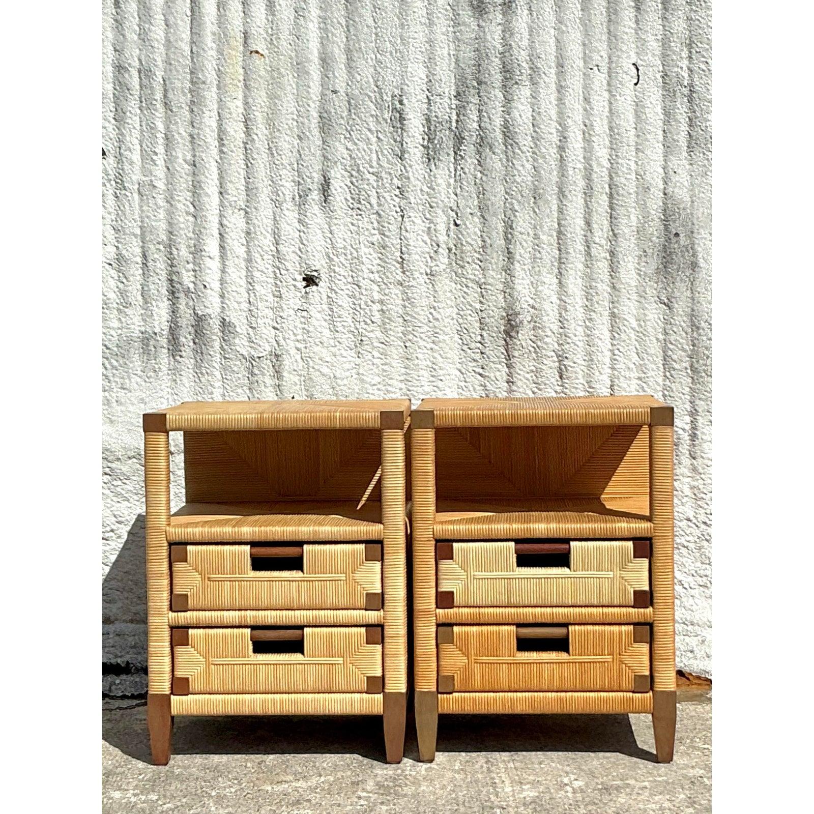 Elevate your space with this exquisite pair of vintage Donghia rattan nightstands, a perfect blend of coastal charm and timeless craftsmanship. The intricate woven rattan detailing, combined with geometric accents, showcases the meticulous artistry