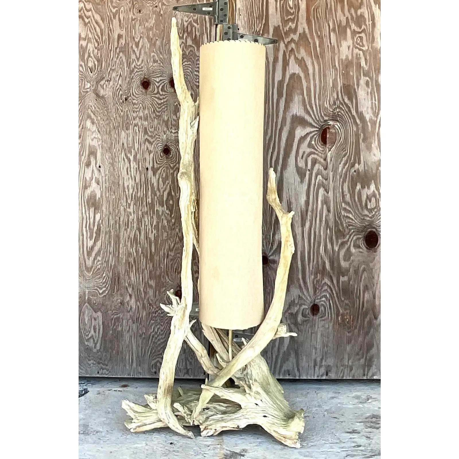 Incredible vintage Boho floor lamp. A chic MCM driftwood lamp with super long shade. Whipstitch trim to the shade. Beautiful light colored natural driftwood. Acquired from a Palm Beach estate.

The lamp is in great vintage condition. Minor scuffs