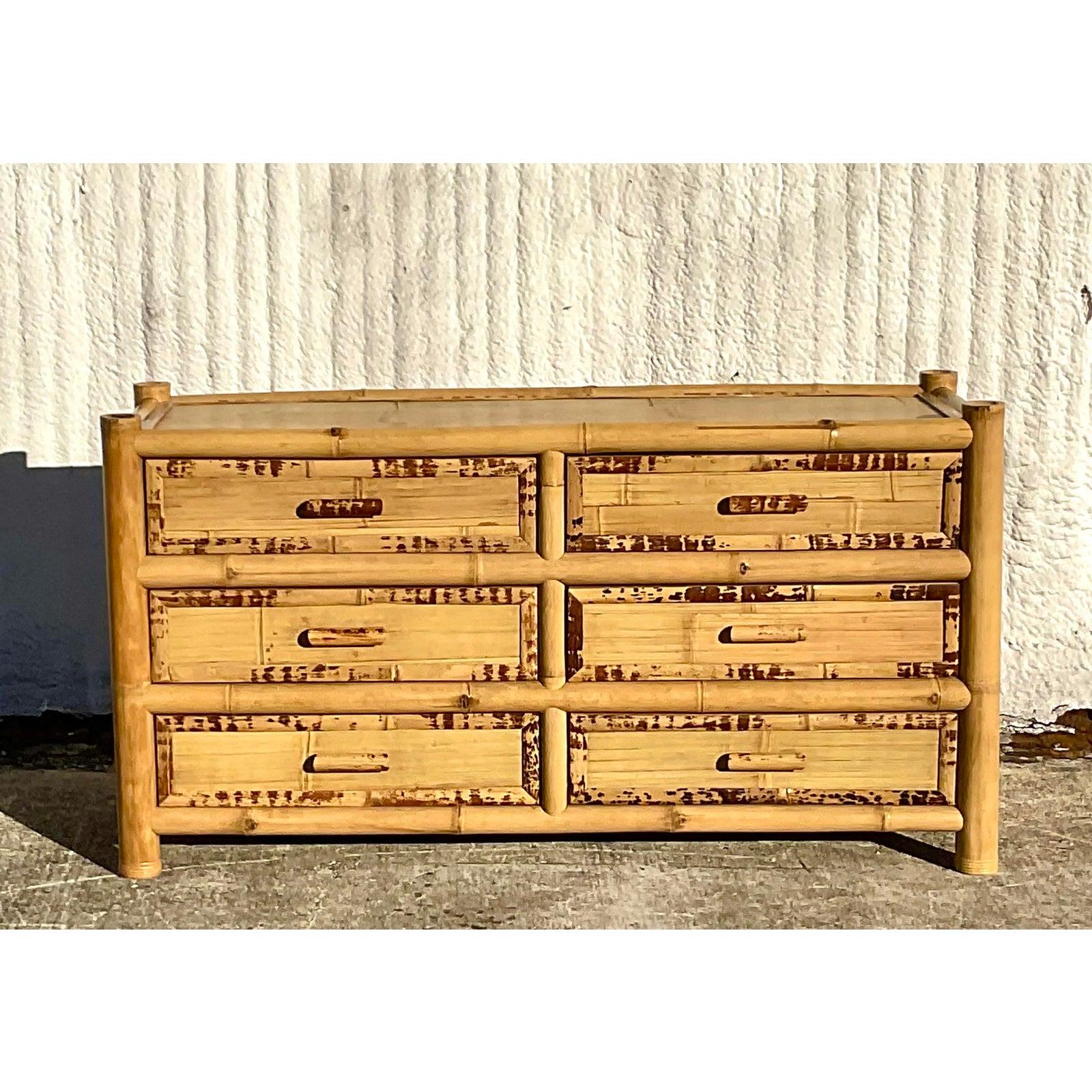 Fantastic vintage Coastal dresser. Chic elephant bamboo frame with inset split bamboo inset panels. Lots of texture and drama. Acquired from a Palm Beach estate.