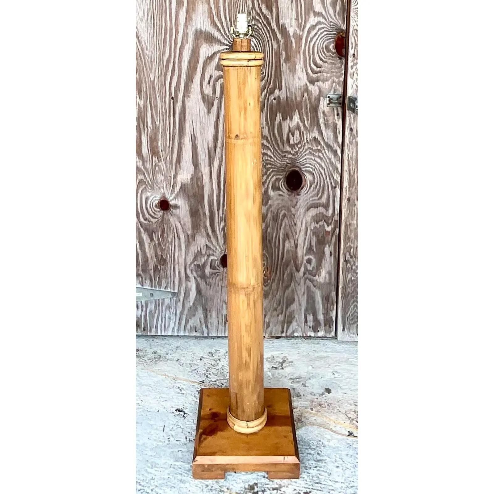 Spectacular vintage Coastal floor lamp. One commanding stalk of elephant bamboo on a chic pine plinth. The height of classic Palm Beach. Acquired from a Palm Beach estate.