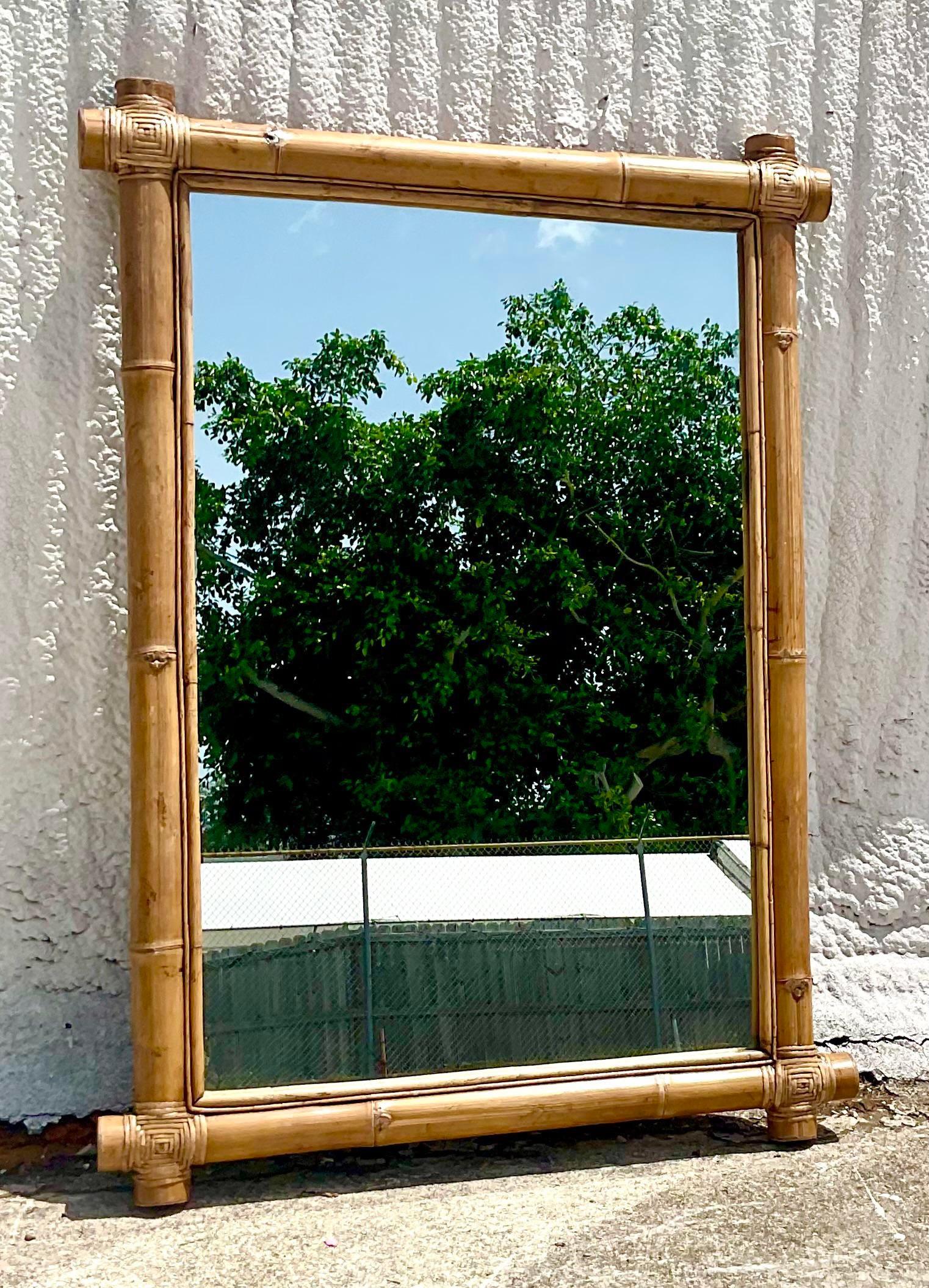 Fantastic vintage Coastal mirror. Beautiful elephant bamboo with wrapped leather corners. Large and impressive. Acquired from a Palm Beach estate.