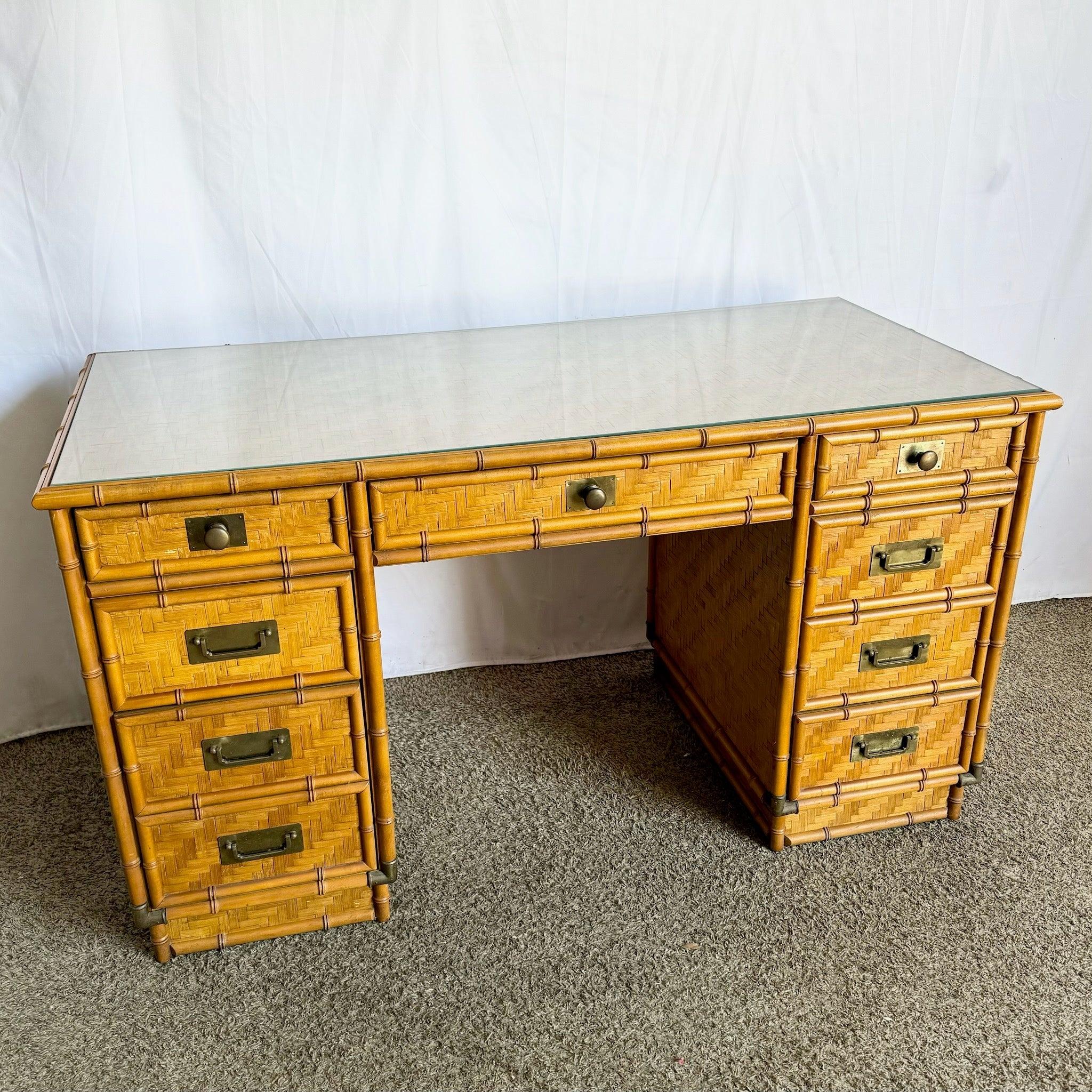 Vintage Coastal Faux Bamboo Campaign Desk with herringbone wicker, glass top, and brass hardware—elegant and functional design.​
 
 Some wear to the brass and edges as shown in the photos.