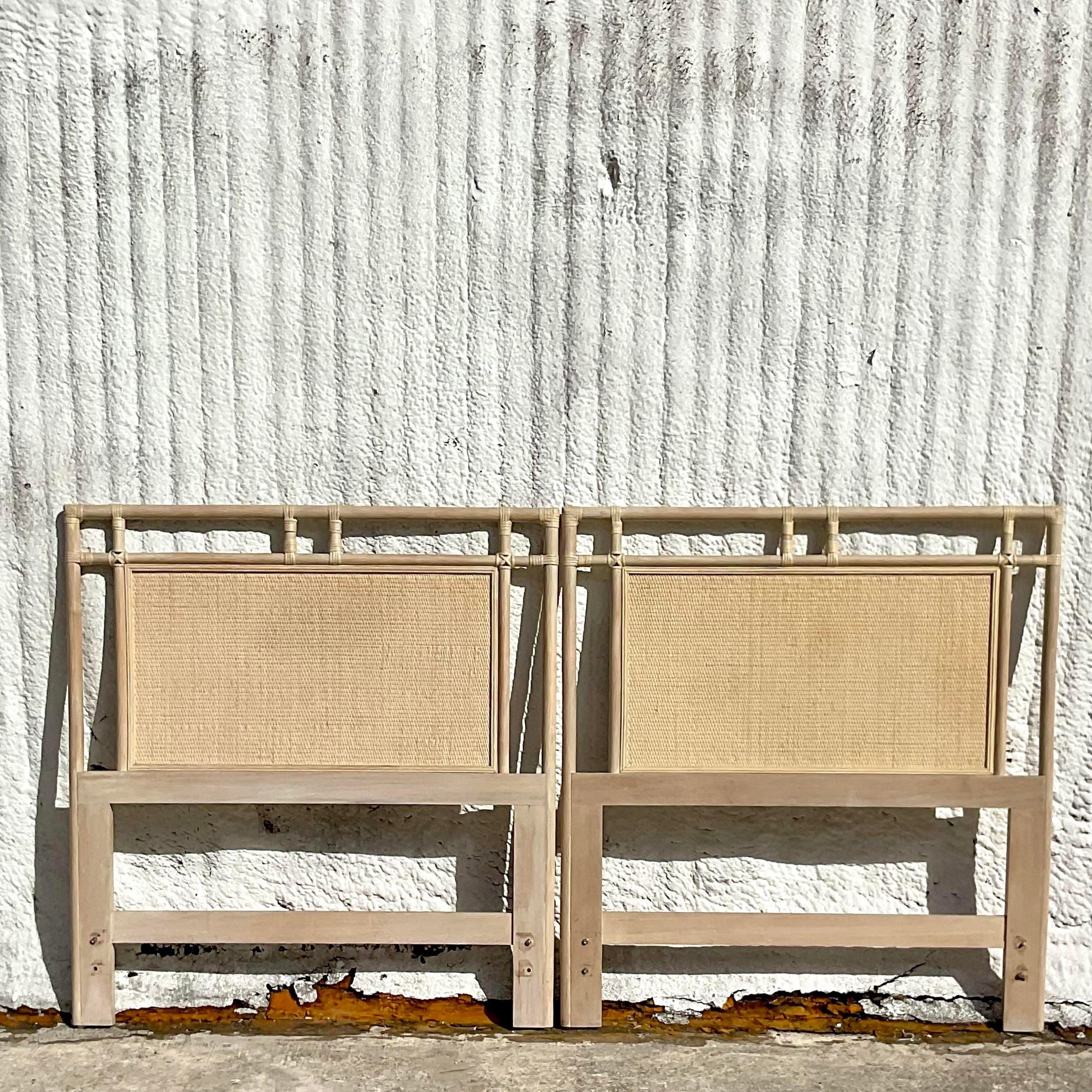 A fabulous pair of vintage Coastal twin headboard. Made by the iconic Ficks Reed group. A chic cerused rattan in a clean linear design. Acquired from a Palm Beach estate.