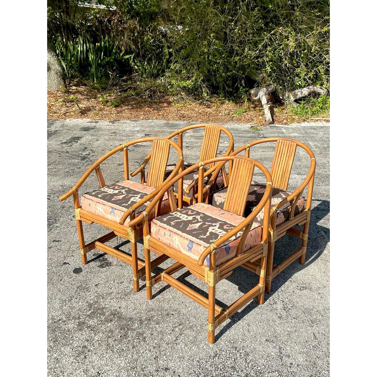Elevate your dining space with this exquisite set of four vintage Ficks Reed Wishbone chairs. Crafted from durable rattan with a beautifully curved wishbone frame, these chairs exude a breezy coastal charm, making them the perfect addition to any