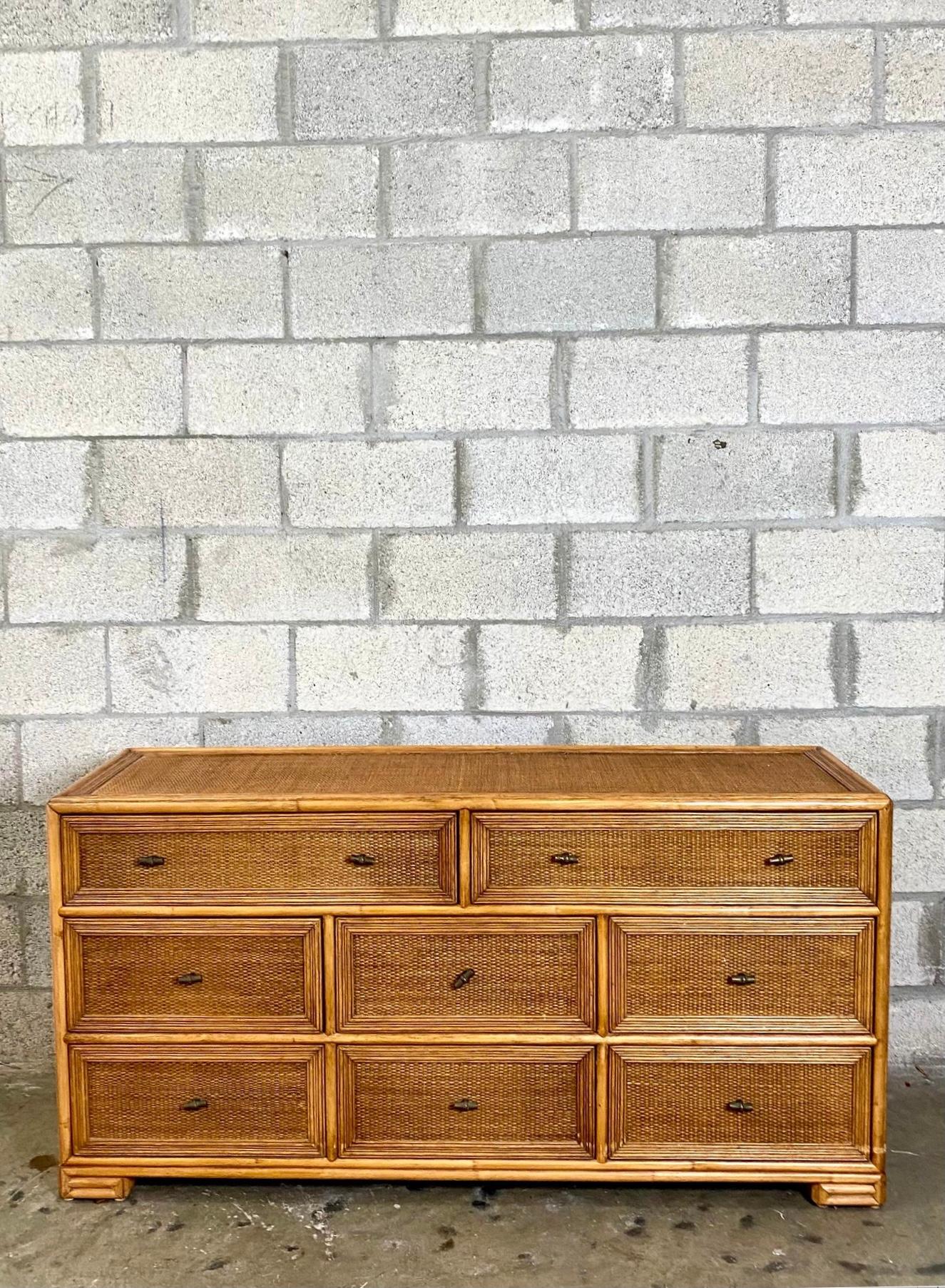 Gorgeous vintage coastal woven rattan dresser. Made by the iconic Ficks Reed groups. Beautiful wooden frame with inset woven panels. A real showstopper. Acquired from a Palm Beach estate.