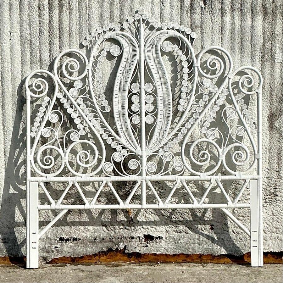 Bring seaside charm and natural elegance to your bedroom with this vintage Coastal Fiddlehead rattan queen headboard. Featuring an intricate fiddlehead-inspired design, this piece captures the essence of relaxed, beachy living with its airy,