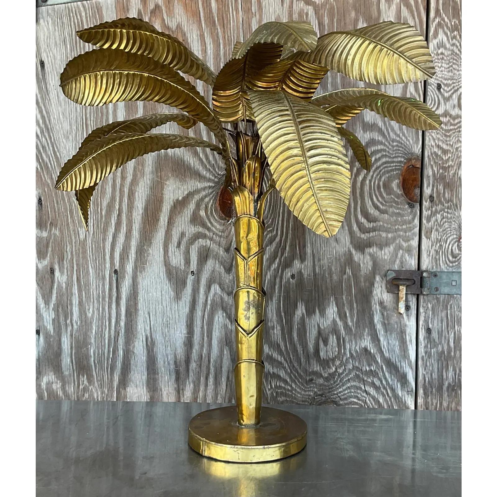 A stunning vintage Brass table top palm tree. Imported from Paris by the Maison Jansen group. A great way to add a flash of glamour to any space. Put it on a pedestal for extra height. Acquired from a Palm Beach estate.
