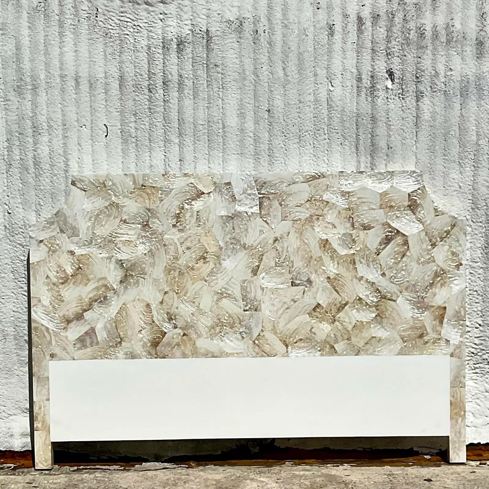 A spectacular vintage Coastal King headboard. The “Gabrielle” style made from the coveted Kabibe Shell in a chic notched corner design. Acquired from a Singer Island estate.