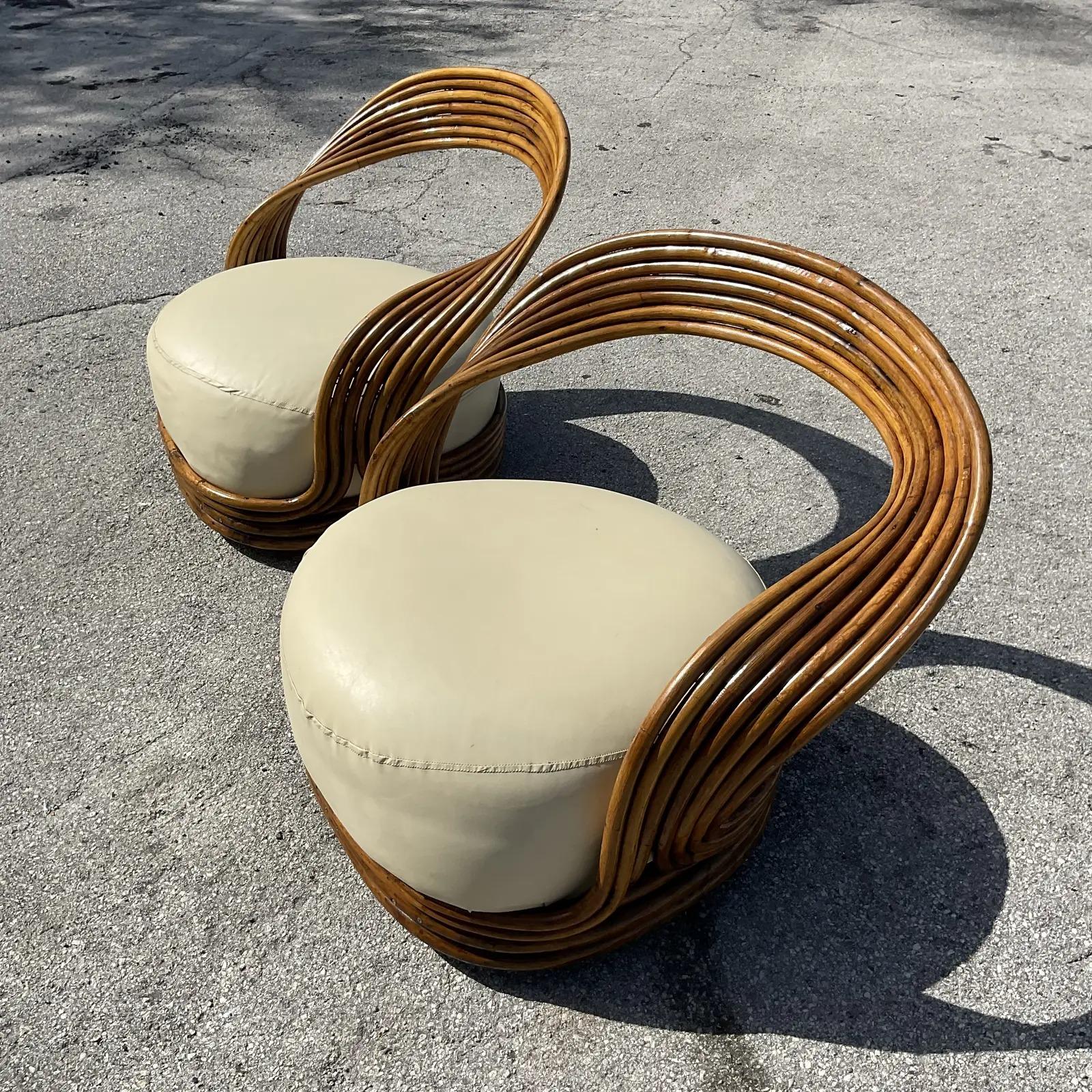 Incredible pair of vintage Coastal lounge chairs. The coveted “Eva” chair by Giovanni Travassa for Bonacina. Beautiful fluid organic lines. Acquired from a Palm Beach estate.
