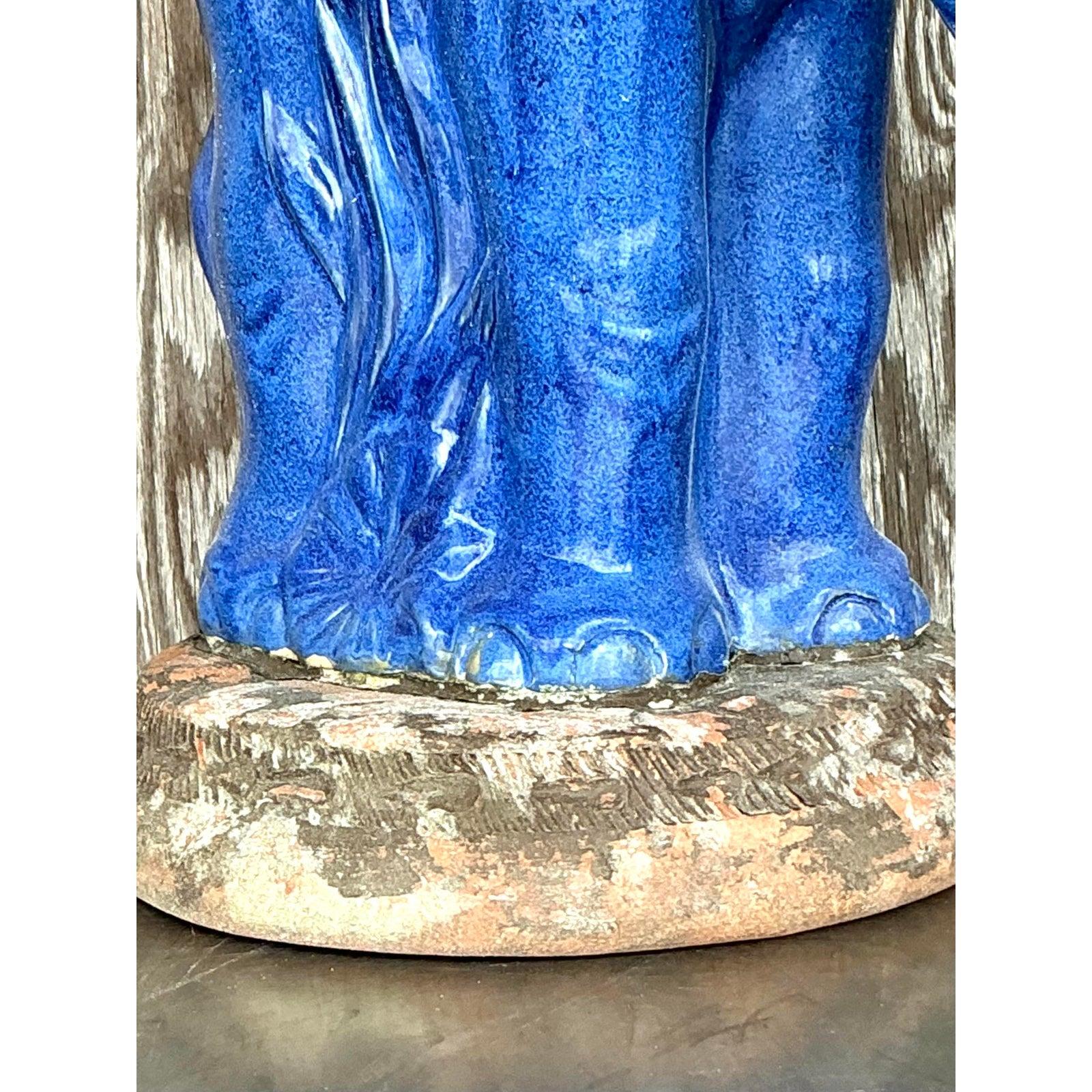 Radiating charm and artisanal craftsmanship, this vintage ceramic elephant planter is a striking decorative piece that blends whimsical character with rich coastal appeal. Hand-glazed in a vivid cobalt blue with finely molded botanical motifs, this