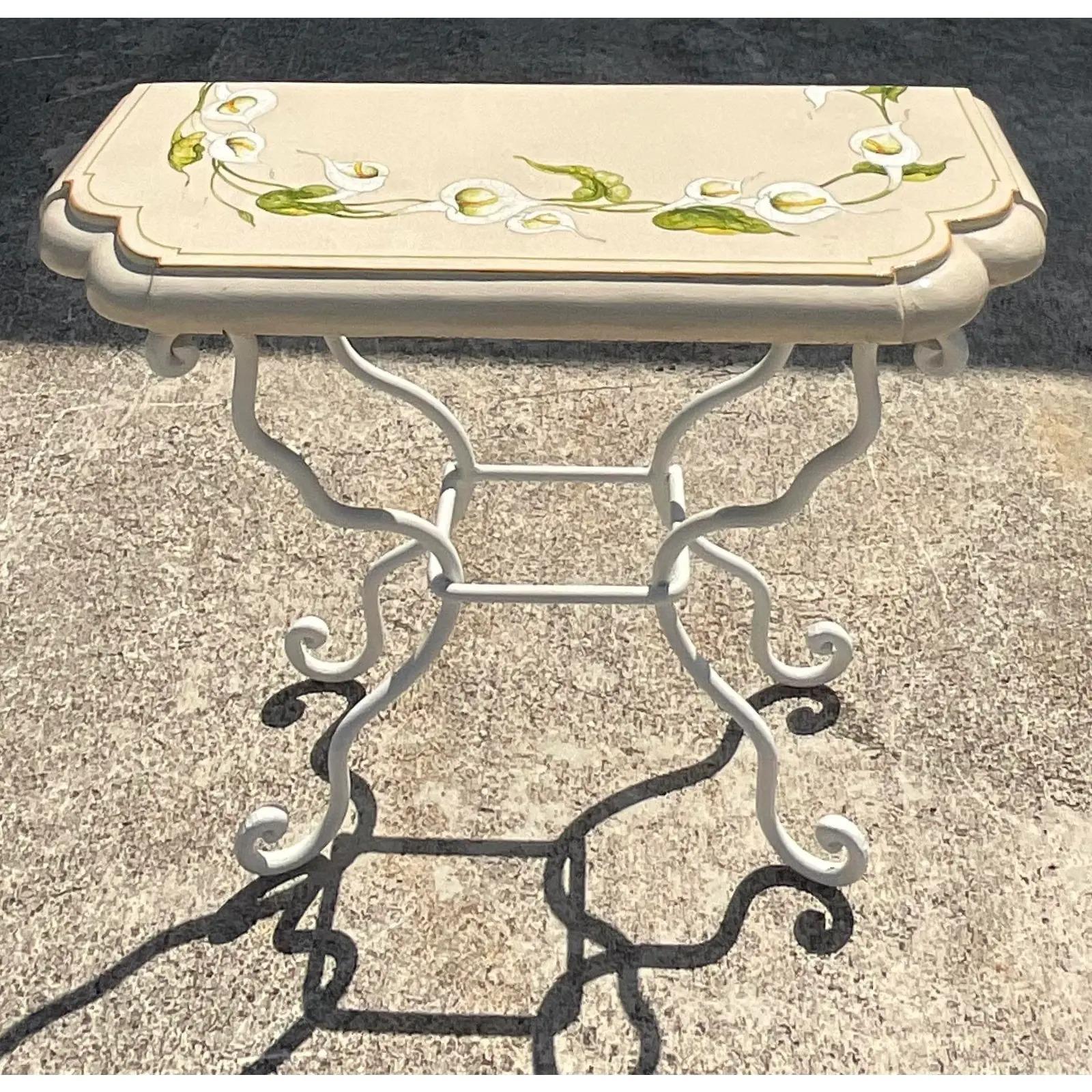 Fantastic vintage Coastal console table. Beautiful glazed terracotta top on a wrought iron base. Beautiful ring of hand painted lilies. Acquired from a Palm Beach estate.