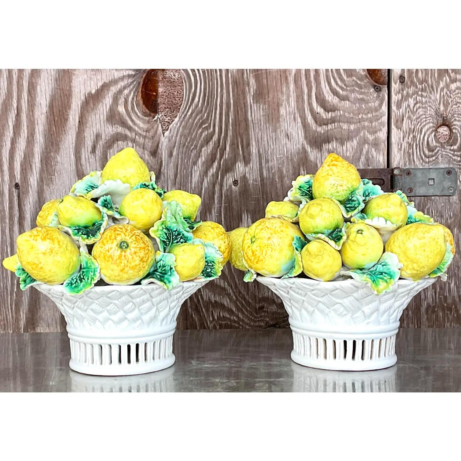 A fantastic pair of vintage glazed ceramic centerpiece basket. A chic Italian lemon topiary with beautiful attention to details. Gorgeous colors. Marked on the bottom. Acquired from a Palm Beach estate.