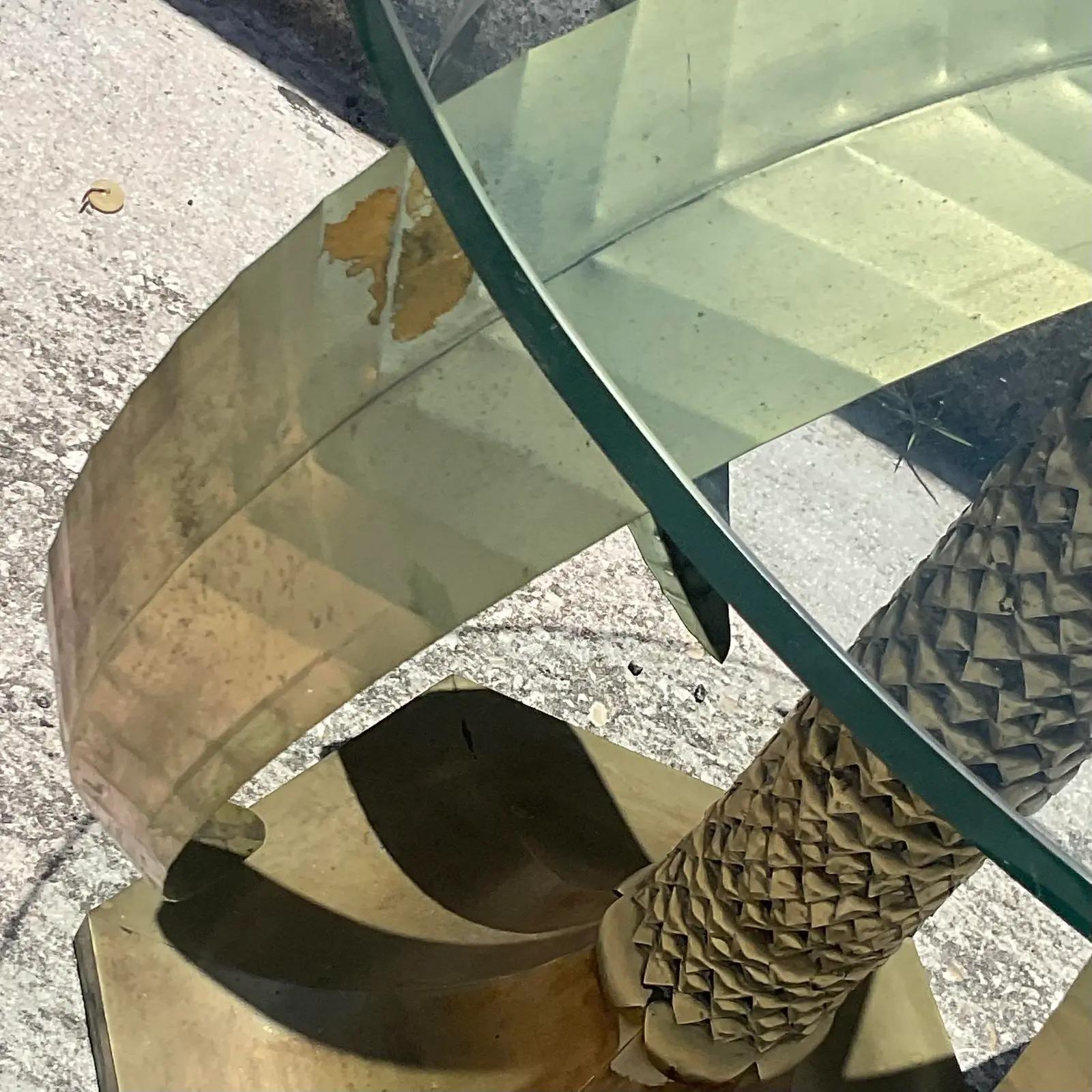 Fantastic vintage Coastal side table. Beautiful hammered brass in a chic palm tree design. Glass top. Acquired from a Palm Beach estate.