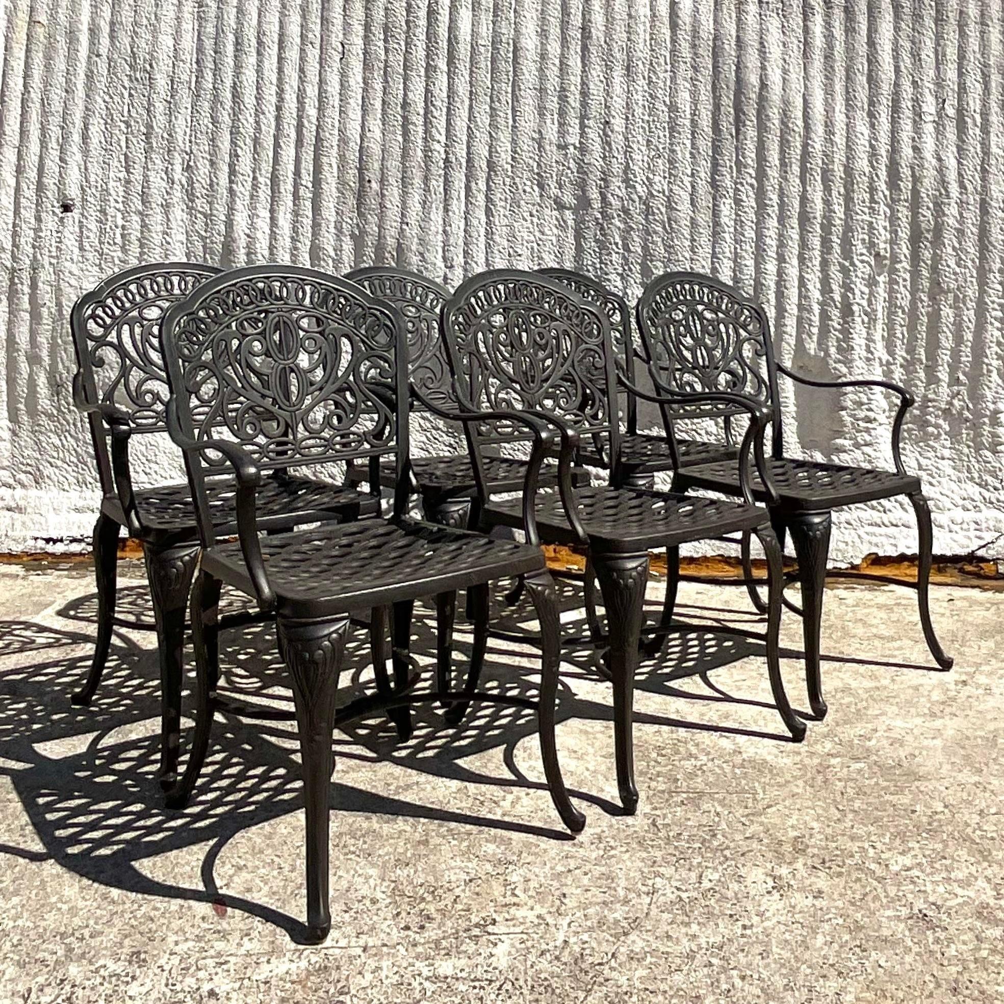 A fabulous set of six vintage Coastal outdoor dining chairs. Made by the iconic Hanamint group and tagged on the bottom. Chic cast aluminum frame in a fabulous loop design. Coordinating oval dining table also available on my page. Acquired from a
