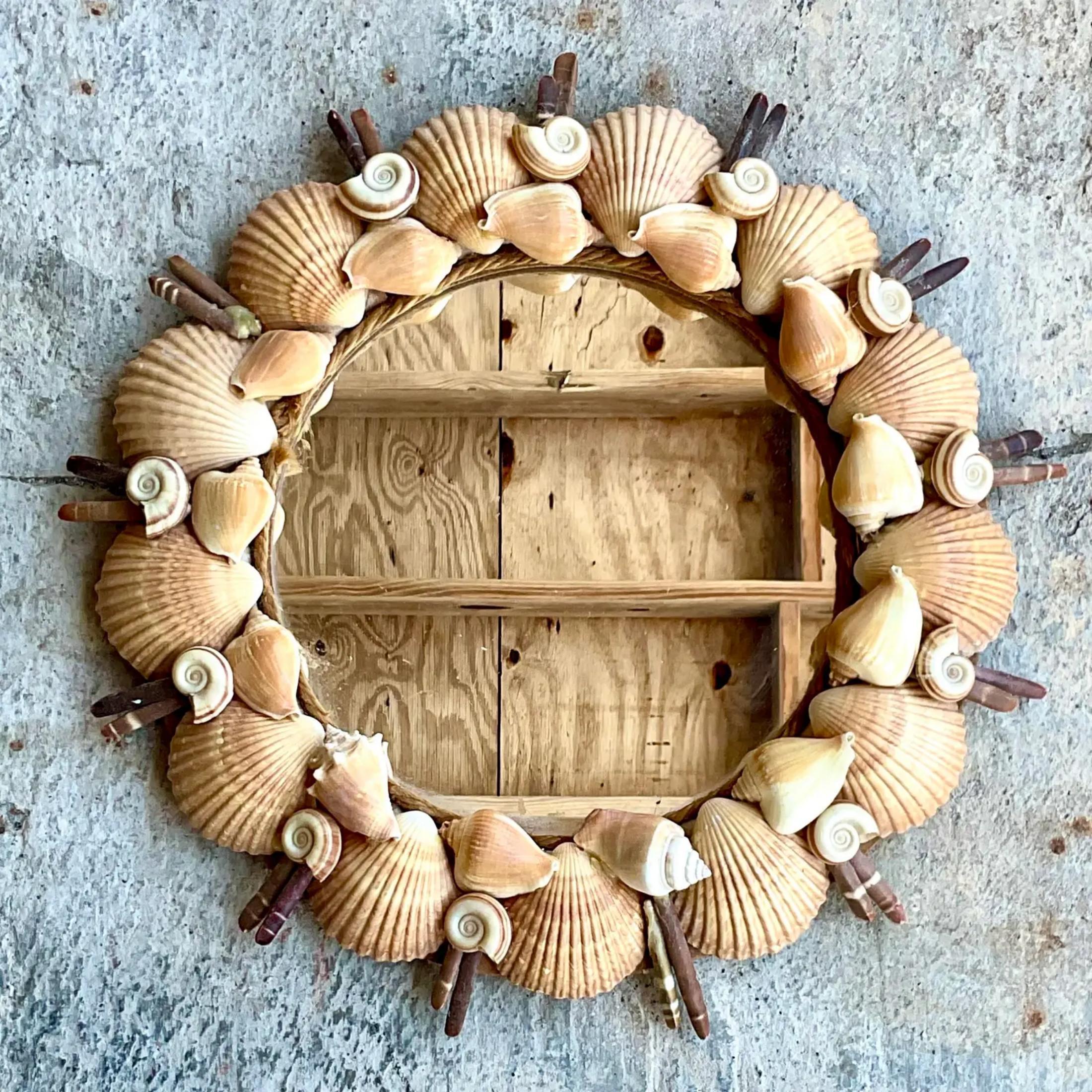 Fabulous vintage Coastal shell mirror. Beautiful hand made ring of shells in warm browns and neutrals. Acquired from a Palm Beach estate