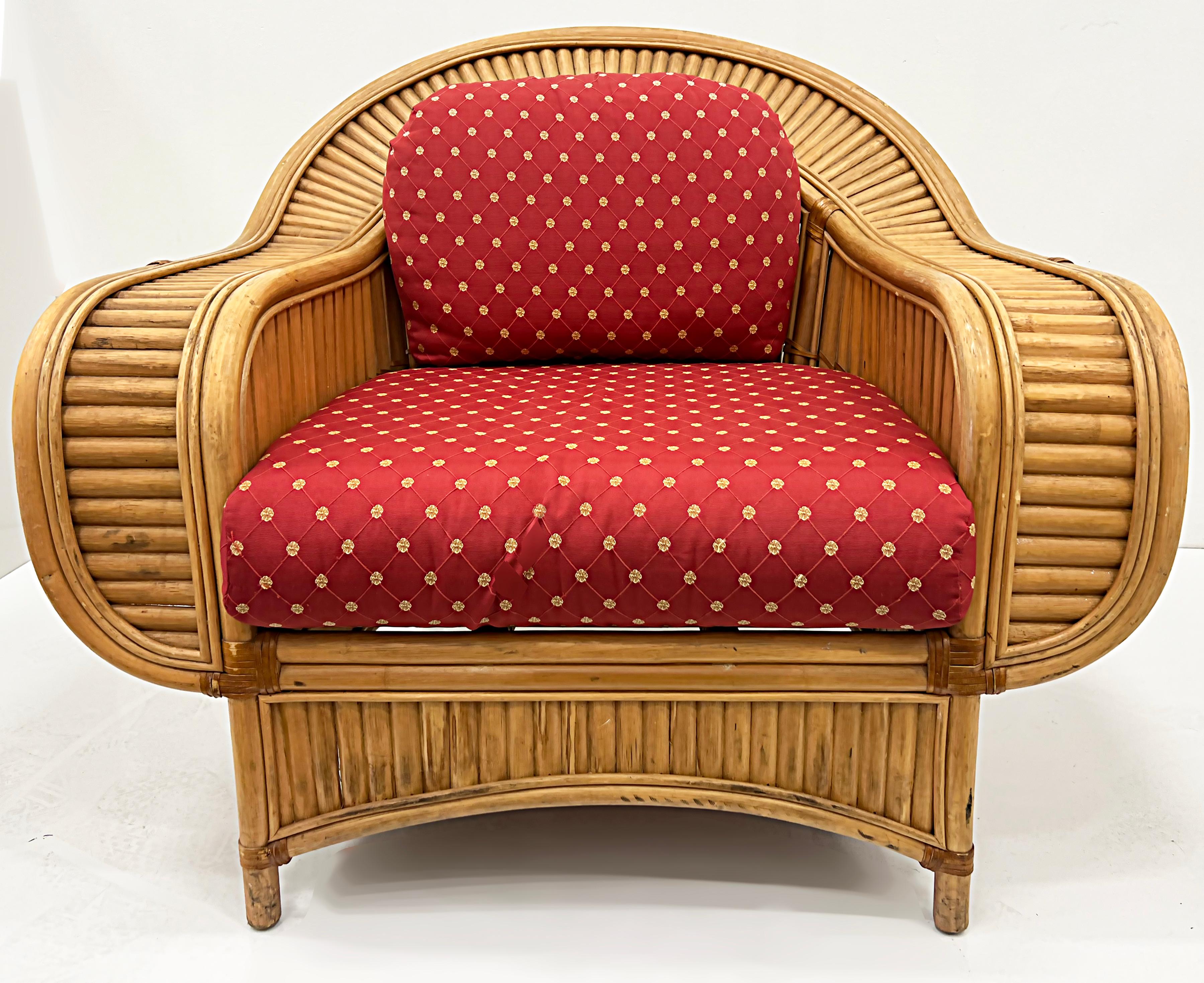 
Vintage Coastal Henry Olko Style Rattan Club Chairs with Leather

Offered for sale is a sculptural pair of substantial 1970s rattan lounge chairs created in the style of Henry Olko. These chairs have removable cushions and are extremely