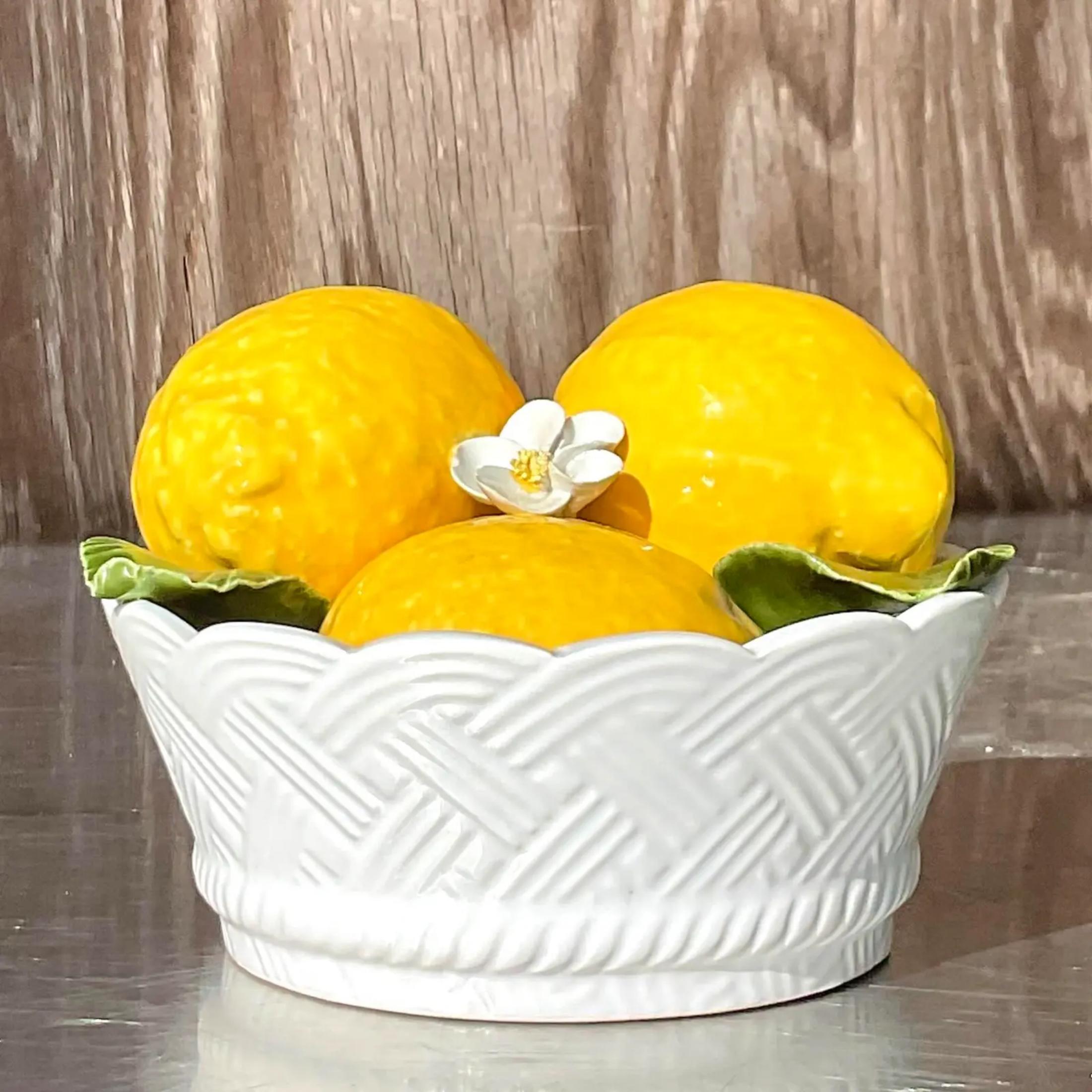 A gorgeous little glazed ceramic lemon bowl. Bright clear colors dominate this piece. Signed made in Italy on the bottom. Acquired from a Pal Beach estate.